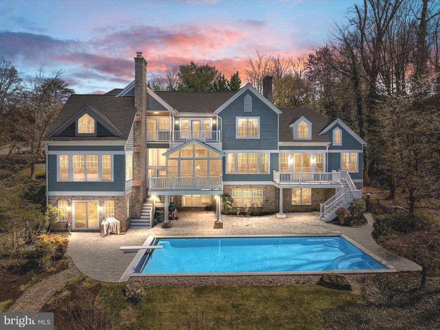 This GORGEOUS home is a 10!!  Nestled on a quiet cul de sac among 8 other custom homes in the exclusive community of Bancroft on the Severn.  This  house has everything you would want to enjoy a fun filled Annapolis lifestyle .. located just 4 miles from DT Annapolis and a quick jog to the B/A paved trail.

Set along the shores of the scenic Severn River, the home has a private community pier (with the largest lift), lovely winter water views,  new pool with smartphone technology, new hardscape,  new roof in 2021 (40 yr warranty), 3 season porch (2023), stunning remodeled kitchen, first floor master with gas fireplace and deck overlooking the pool, 3 wood burning fireplaces throughout the house, 5 bedrooms (4 with en suite baths), multiple access points to pool and backyard, tankless water heater, new 2nd floor bedroom, sauna, jacuzzi, exercise room, game room, theater, and a living area in the basement with walk out to the pool.

Situated on 1.23 acres of relaxing tranquility, you will also enjoy easy and quick access to Rt 50 and all points North and South.  Note: fire in fireplaces digitally placed.