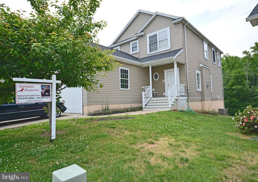 2004 3-level, 2-car colonial 3/3.5 home with walkout basement for TH price!  Bring your renovation loan or cash to secure this fixer-upper for yourself and make it shine again!  Hardwood main level with family room, fireplace, counter bar kitchen, 42" cabinets, stainless range and microwave.  NEEDS WORK: Paint, carpet, HVAC, discoloration (laundry, baths, closet), ctrs, trim, wdws, walls. AS IS.
