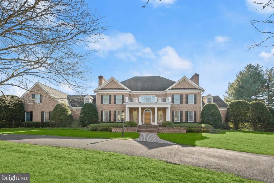 Exquisite Custom Estate on 5+ Acres with Bath House & Guest Quarters, Elevator & Resort-Style Grounds
Privately sited on 5.13 acres, this exceptional custom residence by Vintage Homes offers timeless elegance, thoughtful design, and resort-level amenities in Ellicott City. A circular drive, four-sided brick exterior, covered brick front porch, and professionally designed hardscape set the tone for this impressive estate.
The main residence features generously sized rooms, solid end-grain wood floors, solid core interior doors, 6" interior walls, plantation shutters, and abundant storage throughout. A dramatic double staircase graces the entry foyer, complemented by a secondary rear stair and a private elevator with new hydraulics for seamless access to all levels. Formal living and dining rooms are anchored by gas fireplaces, while the family room showcases a Palladian window and dual access to two expansive patios—ideal for indoor-outdoor entertaining. The sunroom offers vaulted ceilings and skylights, flooding the space with natural light.
Designed for both comfort and functionality, this luxury home includes a commercial-grade gas line for a future generator, radon mitigation system, and a fully finished lower level with double-door walk-up, recreation room, kitchenette/wet bar, office, and extensive unfinished storage.
The outdoor living experience is unparalleled. Enjoy a heated in-ground saltwater pool with fountain, hot tub, exterior sound system, mature trees, garden walls, and multiple patio areas—perfect for entertaining or quiet relaxation. A remarkable 1,800-square-foot detached bath house and guest quarters with dedicated utilities offers endless possibilities for extended family, guests, or au pair accommodations.
Additional highlights include a four-car side-loading garage with extra side parking, in-ground pool infrastructure, professional landscaping, and well and septic systems. Offering 5 bedrooms, 4 full baths, and 2 half baths, this transitional-style estate delivers privacy, quality construction, and refined living—just minutes from commuter routes, dining, and shopping.
A truly rare offering combining luxury, scale, and versatility in a premier Howard County setting.