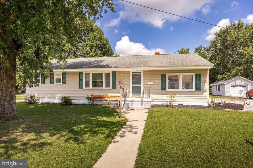 Welcome to this charming ranch-style home situated on a large corner lot, offering 3 bedrooms and 1 full bath. Featuring hardwood floors and fresh paint, this home is all ready for new owners. The kitchen has been relocated to a space just off the family room, but the original space still has its cabinetry in place. It can now be reimagined to fit your needs-whether it be a home office, playroom for the kids, or craft room.  An oversized two-car detached garage provides plenty of room for parking, storage or a workshop. Enjoy the benefits of no city taxes with public sewer and well water. This property combines functionality and value making it a wonderful opportunity to own a home with plenty of space inside and out. Close to shopping, schools, restaurants, Salisbury University and Tidal Health.