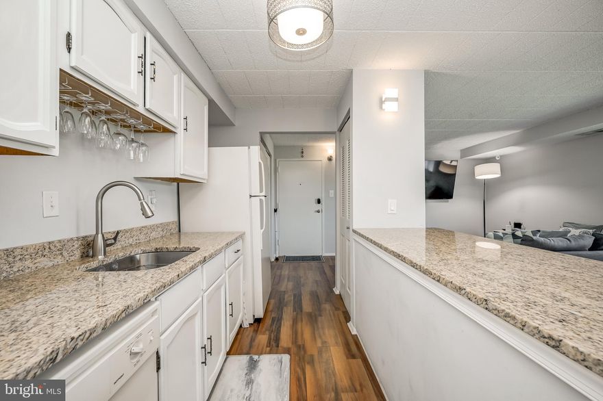 Welcome to your new cozy, light, bright & beautiful home at 997 Heather Ridge Drive #3C, strategically nestled in a prime location close to Fort Detrick, Frederick Community College, Hood College, and Mt. Saint Mary's College, & close to commuter routes to Washington DC & Baltimore; easy access to MD-15, I-270 and I-70. Walkable to public transportation & just a quick drive to the amenities, shops & restaurants in downtown Frederick.  Step inside this beautiful, comfortable & stylish first-floor 2-bedroom, 1 bath unit to discover luxury vinyl plank flooring flowing seamlessly throughout, setting the stage for a contemporary and stylish living experience. You're welcomed by updated lighting, a spacious living room that flows effortlessly into the open kitchen. The kitchen's design allows you to stay connected with loved ones in the living room, whether you're preparing a meal at the granite counter top breakfast bar or entertaining guests. Recent paint throughout enhances an already bright and inviting atmosphere. The master suite is a true retreat, boasting a spacious closet for ample storage. A large second bedroom provides flexibility & versatility for guests, a home office, or additional living space. Enjoy the convenience of an in-suite room equipped with new (2023) washer and dryer, making daily laundry a breeze & adding a touch of practicality to your daily routine.  HVAC was replaced in 2021! One final standout feature of this home is its abundant storage options, making it easy to keep your belongings tidy and accessible. Four (4) parking permits (2 resident and 2 visitor) convey.  Don't miss the chance to call this stunning condo your new home!  This condo development is not FHA or VA approved.