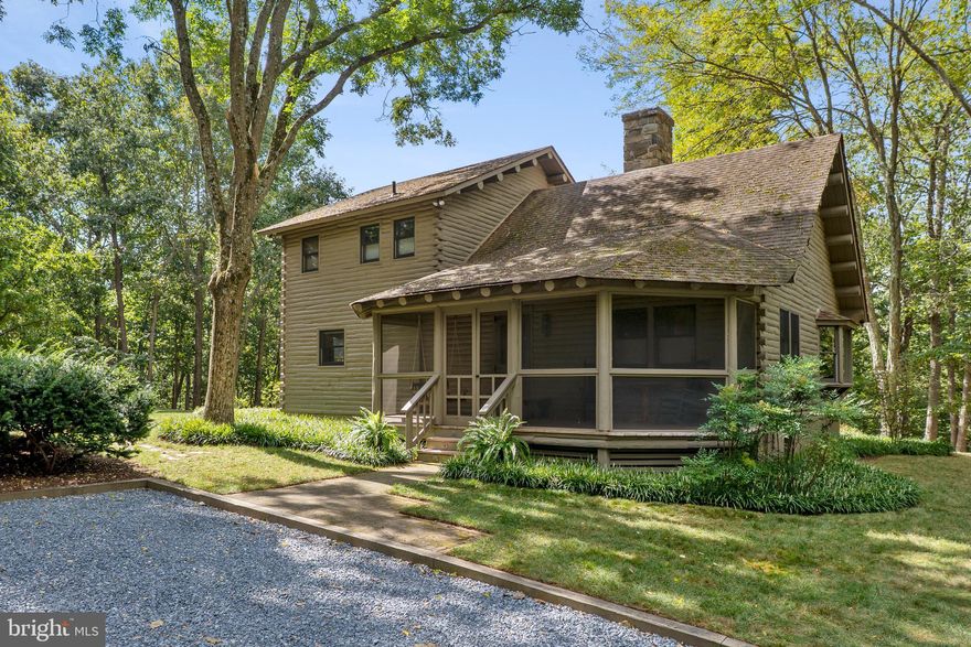 This property is a little slice of heaven.  Your own oasis of privacy.  You would never know that you are only 5 minutes away from I-270 and 15 minutes away from the Capital Beltway.  There are 7.3 acres of mostly treed land with about half an acre of cleared land around the home.  Among the trees are 8 fully established American chestnut trees and a professionally landscaped design.  This custom-built log home is constructed of white cedar logs making it naturally resistant to insects without any chemicals. Step inside to the gleaming white oak floors throughout the majority of the first floor.  Observe the centrally located wood stove backed by stones that was quarried from the Potomac that reaches up to the peak of the cathedral ceiling with lovely uplighting.  The owner's suite is located on the second floor with its own private balcony, a walk-in closet and bath. In addition to the living room, dining room and kitchen with an abundance of storage in the custom-made cabinetry, there are also 2 good sized bedrooms on the main level.  The lower level is partially finished with a great family room. There is also a walk-out, tons of storage and plenty of room for hobbies like wood working. This home has a very large, screened porch, a balcony and a large freshly stained deck with stairs to the yard. You will never want to leave! And for you work from home individuals, high speed internet is available.  There is a permanent creek located in the woods.  The seller has marked the corners of the lot for you and there is a plat in the document section of the mls.  There are stunning views from every window so you can enjoy the abundant perennials that start blooming in January with the winter blooming Jasmine and proceed through spring and summer, then finish with the wonderful colors of fall.  Unique properties like this rarely become available.  Don't miss your chance to own private, wooded sanctuary where joy, happiness and bliss abound.