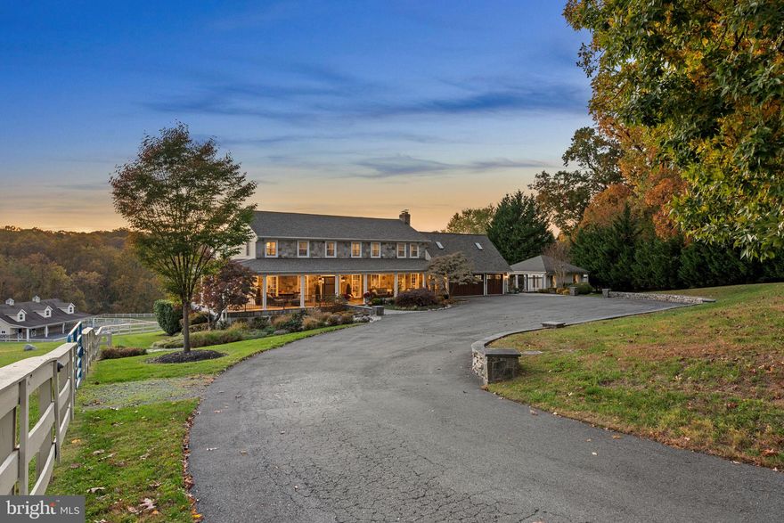 Proudly presenting one of the most exquisite luxury estates ever constructed in Howard County; 7122 Deer Valley Road. A property of this caliber becomes available for sale once in a lifetime. Enter the realm of unparalleled luxury and sophistication, where equestrian dreams become reality. Fully reconstructed inside and out over the last several years, and sited in the River Hill High School district, this elite equine estate offers a sanctuary for both horse and rider. The property is a masterful blending of world class equine facilities with one of the finest homes ever constructed in this region. Spread across 5.38 acres of fully-fenced, private grounds, this property harmoniously blends natural beauty with refined living. The panoramic views of rolling pastures and lush woodlands provide a picturesque backdrop, creating an idyllic setting for both relaxation and recreation. With over 5,700 total square feet of high-end finishes and high-demand features, the main home provides you with ample space, exquisite detail, and the modern functionality you expect from a luxury home, while at the same time honoring the rich equine heritage of Highland with the farmhouse character and design. From the automatic front gate, to the massive parking area, the covered front porch, stone exterior, and expansive, professionally landscaped beds, to the world class fitness center and outdoor entertainment area complete with the fire pit, full outdoor kitchen, and massive salt water pool overlooking the pasture, this property stands out as a premium offering in every way. The high-end kitchen is a masterpiece, featuring the finest in luxury appliances and bespoke craftsmanship. A Sub-Zero refrigerator and wine cooler, symbols of unparalleled freshness and precision, paired with top-of-the-line Wolf appliances, including a state-of-the-art gas range, built-in wall ovens, sleek microwave, warming drawer, and ice maker, this kitchen is designed for both the gourmet chef and the casual cook. The kitchen's crowning glory is its custom cabinetry, crafted with outstanding attention to detail. The spacious, beautifully designed layout includes an expansive island with a polished granite countertop, perfect for both everyday meals and grand gatherings. The kitchen is bathed in natural light, offers a breathtaking view of the pasture, highlights rich textures and finishes, and creates a warm, inviting atmosphere. Embrace the art of cooking in a space that combines luxury, style, and function to create the ultimate kitchen experience. The centerpiece of the property is the state-of-the-art equestrian complex. The main barn features three spacious, climate-controlled stalls, each equipped with premium rubber flooring, fly control system, and automatic waterers. Adjacent is a sophisticated tack room, feed room, a grooming area, and a wash stall with hot and cold water. A separate riding ring equipped with LED lighting allows you to ride into the night and provides multiple locations on the property to practice. This resort-style home will become your friends and family’s favorite place to visit. The barn conveniently offers a two level apartment complete with a full kitchen, bathroom, bedroom, and sizable living space. The barn also offers the perfect space for automotive collectors, artists/musicians, or your home business - ask for additional detail on the variety of possibilities for this space. The home, barn, and all equipment are in pristine condition and have been updated according to the luxury home standards of today. For a full list of features, finishes, ages, and improvements please reach out directly. This home will be expertly transferred to the new owner through a warm handoff and thorough orientation of all systems and operations.