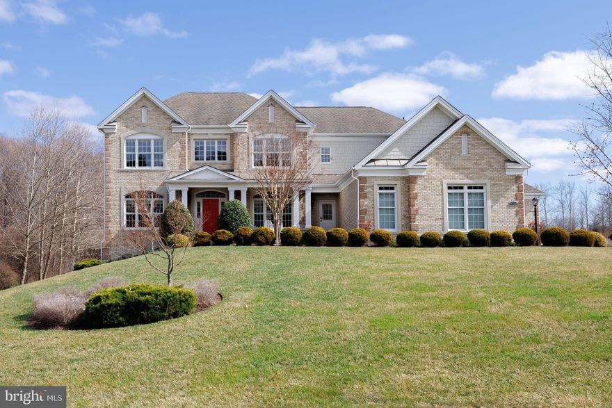 Luxury Living in Cattail Overlook – A Masterpiece of Space & Elegance. Welcome to 14926 Victory Ln, a truly spectacular estate in the prestigious Cattail Overlook community. Set on nearly an acre of beautifully landscaped grounds, this 7,585 sq. ft. residence is a perfect blend of sophistication, comfort, and versatility—ideal for modern living and multi-generational needs. Step through the grand entrance into a stunning two-story foyer, where an elegant main staircase sets the stage for the home’s refined charm. A second back staircase enhances convenience, seamlessly connecting the heart of the home. The main level boasts 4,800 sq. ft. of thoughtfully designed space, featuring a dedicated study, a light-filled sunroom, and a charming music room—ideal for work, creativity, and relaxation. The gourmet kitchen is a chef’s dream, complete with multiple work areas, an oversized island, and a seamless flow into the spacious family room with a cozy fireplace. It really is the heart of the house. A mudroom with a side door and a dedicated laundry room add convenience to everyday living. Unique to this home is a completely self-sufficient “1 bedroom living space”, just off the kitchen.  With a separate entrance, 1-bedroom, private bathroom, prep area and living room it provides convenience, comfort and independence.  It is ADA certified too.  

The upper level offers four generously sized bedrooms and three full bathrooms. The grand primary suite is an opulent sanctuary featuring a private sitting area, its own gas fireplace, two expansive walk-in closets, and a spa-inspired en-suite bath with dual vanities, a soaking tub, and a walk-in shower. And if you need even more living space, the full walk out lower level just awaits your creativity. Step outside to a private oasis, a stunning level fully fenced back yard backing to a privacy cluster of trees.  A huge Trex deck and a beautifully crafted stone patio with a firepit provide the perfect setting for outdoor gatherings. 

Over the past six years, the home has seen numerous upgrades, including the expansive new patio, wrought iron privacy fence, whole house generator, new water heater, front walkway, enhanced landscaping, custom closet systems, and built-ins in both the office and mudroom. The meticulously maintained hardscaping enhances the home’s curb appeal, creating a serene retreat for relaxation. A massive three-car garage offers ample space for vehicles, storage, and hobbies. Thoughtful details throughout the home ensure both beauty and functionality. This exquisite estate also offers an attractive VA-eligible assumable loan for the right buyer. Don’t miss your chance to own this exceptional luxury residence in Cattail Overlook in the finest Howard County school district.