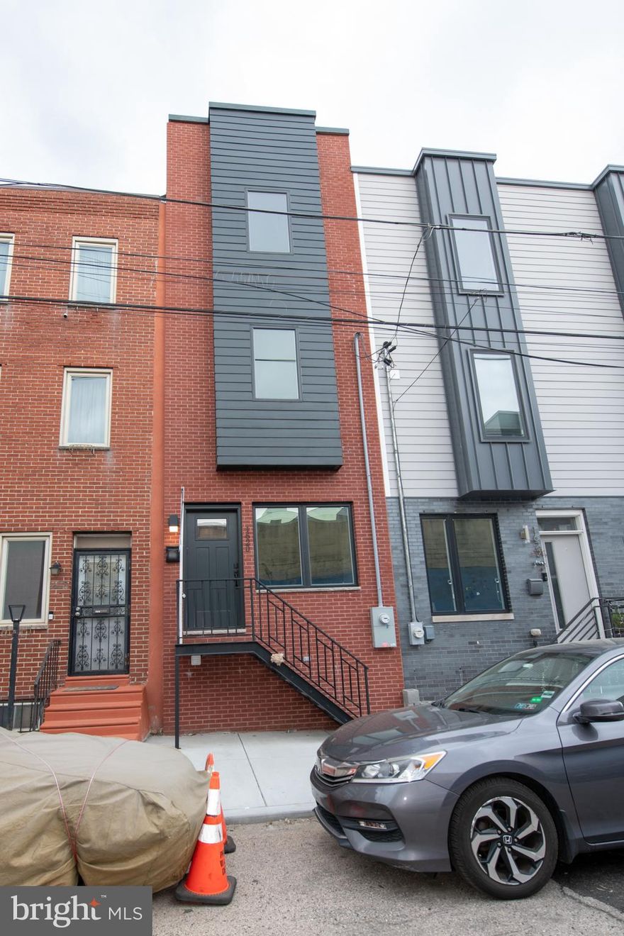 Location Location Location ! Welcome to 1620 N Randolph Street-an Absolutely stunning 3 Bedroom, 2 bathroom, conveniently nestled between Northern Liberties and Fishtown. Enjoy luxury and lifestyle in this rapidly growing developing neighborhood. Home features a 10  year tax Abatement and a 1 year builders warranty. The luxury finishes and modern open layout makes this home simply a dream. First floor features open living room , high ceilings and natural light. It leads into the kitchen with quartz countertops high-end cabinetry and stainless steel appliances. Property has rear yard for BBQ , or morning coffee with an area for your pets. On the second floor, you'll find 2 generously sized bedrooms, each adorned with large windows and ample closet space. The third floor, dedicated to the luxurious primary suite, complete with a walk-in closet and an en-suite bathroom featuring a double vanity and frameless glass shower . Full finished basement for more living space. Custom tiling in all bathrooms, hardwood flooring throughout. Roof-deck with expansive views of the City. Located just steps from the LMNO, Suraya, Lazer Wolf, City Fitness the Market-Frankford  Line, Columbus Blvd, I-95 and more. Propery is ready to go, so make your appointment today! PRICE is amazing for new construction.
