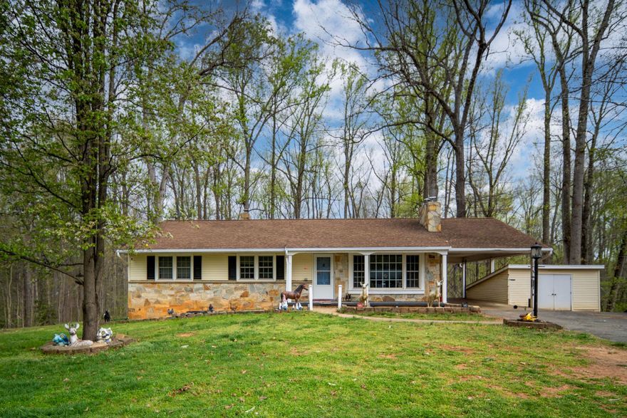 Nestled in the charming area of Richards Ferry Road, this delightful ranch-style home offers a perfect blend of comfort and functionality. Offering mid-century features, this residence has maintained a traditional floor plan that invites warmth and togetherness. Step inside to discover a spacious interior adorned with beautiful hardwood and ceramic tile flooring. With four cozy bedrooms, including 3 on the main level, there's ample space for everyone to unwind. The two full bathrooms and an additional half bath ensure convenience for daily routines. The mostly finished basement, complete with an outside entrance and walkout stairs, provides  a recreation room, bath and 4th bedroom (3 bedroom perk) and additional storage. Natural light pours in through double-pane windows, creating a bright and inviting atmosphere throughout the home. Outside, the property boasts a generous 2-acre lot, offering a serene retreat that backs to lush trees and wooded areas. Enjoy the tranquility of nature right in your backyard, perfect for outdoor activities or simply relaxing on the deck or porch. The exterior features include tasteful lighting and two handy sheds for additional storage, carport a property filled with trees enhancing the overall appeal of the property. Richards Ferry is not just a place to live; it's a location of convenience as it's residence enjoy easy access to local parks, providing ample opportunities for outdoor recreation and leisure, easy access to local shopping, commuter rail, and more.