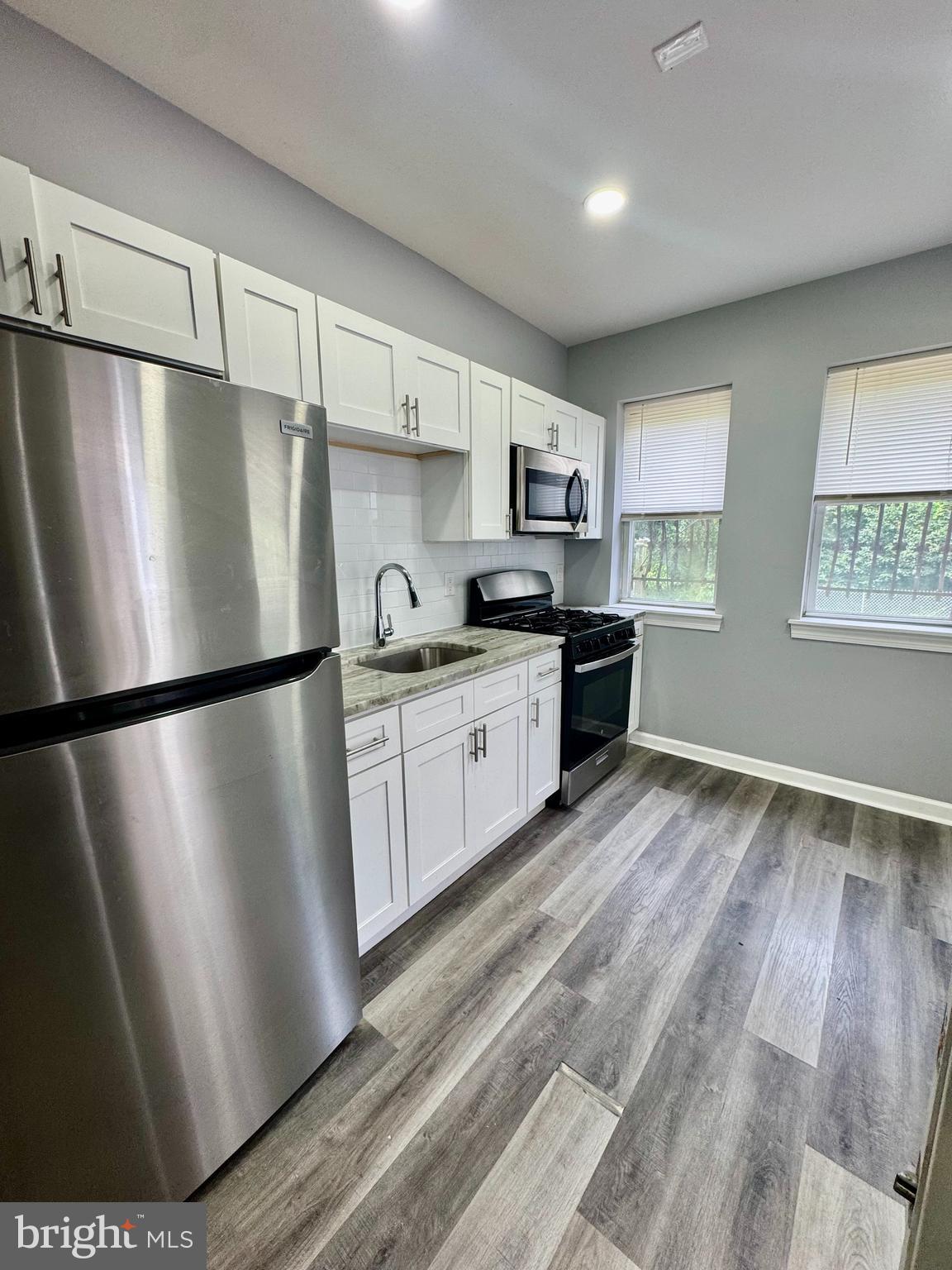 Live at 8119 Suffolk Ave, located in Eastwick. This newly renovated home features 3 spacious bedrooms and one and a half brand-new bathrooms with gorgeous subway tile. The kitchen is complete with new white shaker cabinets, ample cabinet and counter space, and brand-new stainless steel appliances to be installed prior to move-in. Each room is bright and open, offering plenty of storage and large windows that fill the home with natural light. The bedrooms are generously sized with large closets, and you’ll love the amazing backyard, perfect for relaxing on hot days. Additional highlights include washer/dryer hookups and a pet-friendly policy. Be the first to live in this beautifully refinished home!