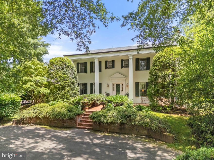 Tucked away behind two stately willow oaks in sought-after Middleburg Downs is "Northwood" offering quiet elegance just minutes west of historic Middleburg. This classic brick Colonial, built in 1977 and thoughtfully renovated over the years, features over 3,500 square feet of finished space on two levels with 4 bedrooms, 3 full baths, and 2 half baths. The front paved parking area is framed by mature boxwoods and leads to lighted brick steps and an impressive columned front porch. Inside, the traditional center-hall layout includes a formal dining room with crown molding and chair rail and a living room with a wood-burning fireplace. Just beyond is a cozy family room with wood-paneled walls, built-ins and another fireplace. The spacious kitchen offers stainless steel appliances, island, custom cabinetry and a charming breakfast nook with views of the rear brick patio, garden beds and expansive lawn. Additional main-level highlights include a screened porch with ceramic tile flooring, two half baths, a mudroom, and a laundry room with access to the garage. Upstairs, the primary suite boasts a spacious sitting area, walk-in closet and a private bath. Two guest bedrooms share a full hall bath, while a fourth bedroom—currently used as a home office—includes two walk-in closets, built-ins and its own full bath. The beautifully landscaped grounds feature mature trees, a fenced vegetable and cutting garden with a garden shed and multiple outdoor seating areas. The rear patio with a fountain offers a perfect setting for entertaining or relaxing in total privacy. Move-in ready and ideally located, Northwood is a rare find just minutes West of downtown Middleburg.