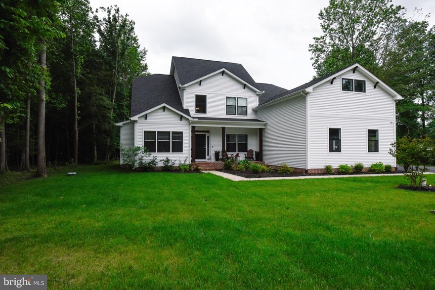 Nestled in the serene Canaan Woods community, this stunning 5-bedroom, 3.5-bathroom, 2 office, and 556 sq foot play / flex room, farmhouse-style home offers a perfect blend of modern comfort and rustic charm. Built in 2022, the property boasts an open floor plan that invites natural light and warmth throughout. The heart of the home features a spacious kitchen with upgraded countertops, stainless steel appliances, and a cozy breakfast area, seamlessly connecting to the dining and living spaces-ideal for gatherings. Retreat to the luxurious primary suite, complete with a walk-in closet and a spa-like bathroom featuring a soaking tub and walk-in shower. Additional bedrooms provide ample space for guests or a home office, while the combination of carpet, luxury vinyl plank, and tile flooring adds both style and practicality. Step outside to enjoy over an acre of beautifully landscaped grounds, complete with a patio, porch, and place for a small solo-style stove perfect for outdoor entertaining or quiet evenings under the stars. The property backs to trees, offering a peaceful, private setting. Located in a rural area, this home is just a short drive from local parks, schools, and essential public services, making it a wonderful place to call home. The community is known for its friendly atmosphere and well-maintained common areas, ensuring a welcoming environment for all. With a three-car garage and ample driveway space, convenience is at your fingertips. Experience the perfect blend of comfort, style, and community in this exceptional property!

This property is on over an acre and has approximately 140k in upgrades.  It is a very well-maintained property. There is a large 600 sq foot playroom above the 3-car garage for multiple options of this area.  It has irrigation on all grass areas and is regularly serviced and properly maintained.  The water pump was upgraded to a 1 HP.  There is a regular pest treatment company that comes for a maintenance (never any pest issues).    There is an electric hook-up on the back of the house that can be either kept as a shed or garage hook-up or reverted to a 50 amp for your camper (which driveway storage is allowed in this neighborhood).  There have never been any pets in the home.  There is only one lot in this wooded and beautiful community left and it isn't as quaint or as large as this one!  The property is move in ready for a large or growing family or someone who just wants extra space to host! 

Sellers are extremely happy with the home and very much enjoy it, they just want to move to a property with more land!  Seller does not have to sell to move to the new property, but they're motivated to sell!