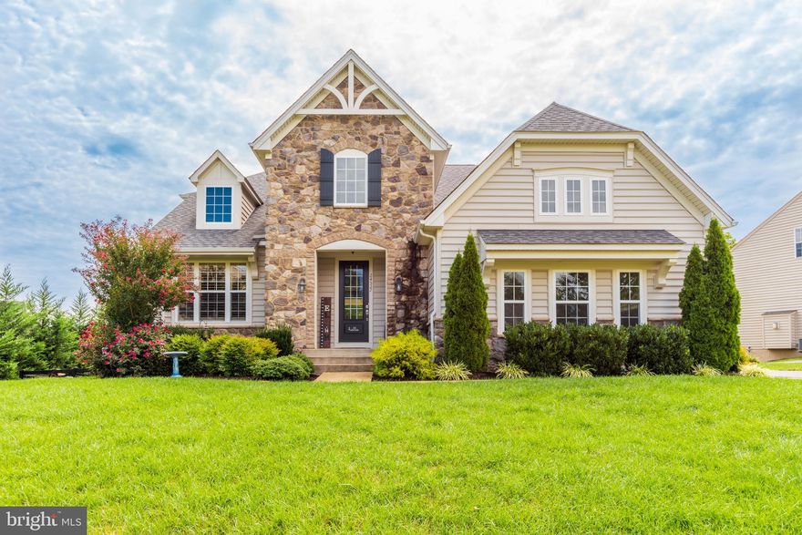 This exquisitely maintained 5BR/3.5BA home is tucked away on a quiet street on the cusp of a cul-de-sac backing to common area! You are greeted upon entry by the gorgeous hardwood floors, with a main level office / bedroom. As you are pulled to the rear of the main level, you will immediately see a wall of windows in both the family room & morning room, allowing you to overlook your private landscaped yard whether cooking, dining or relaxing in front of the cozy fireplace. The expansive chef's eat-in kitchen features a large center island, gas cooktop, double wall ovens, stainless steel appliances and lots of cabinet space! The family room is directly off the kitchen. The main level porch can be accessed right off the kitchen and is just one of multiple outdoor entertaining spaces including large concrete stamped patio with new gazebo! The owners suite features a luxurious master bath with walk-in closets, double vanities, inviting spa-like soaking tub & separate shower. The 3 additional upper level bedrooms are generously sized with large closets! The finished lower level is a walkout so it gets lots of natural light and features a large open space, a full bath and tons of storage. When you step outside you will see this is a premium lot, backing to common area on a flat 0.36 acres. The rear yard is fully fenced, giving plenty of space to relax, play and entertain. The oversized patio is the perfect spot for fall nights in front of a fire pit. Rockbridge is a newer enclave of beautiful homes built just off Braddock Road in Loudoun County, just minutes from rural attractions like Misty Brae horse farm, Chrysalis and Quattro Goomba wineries, and the high-end, small-town charm of Middleburg. All the residential amenities you would need for a new home development can be found in nearby Stone Ridge, South Riding, and the Dulles Landing shopping center, including retail shopping, casual and upscale dining, and the community library! Call now for your private showing!