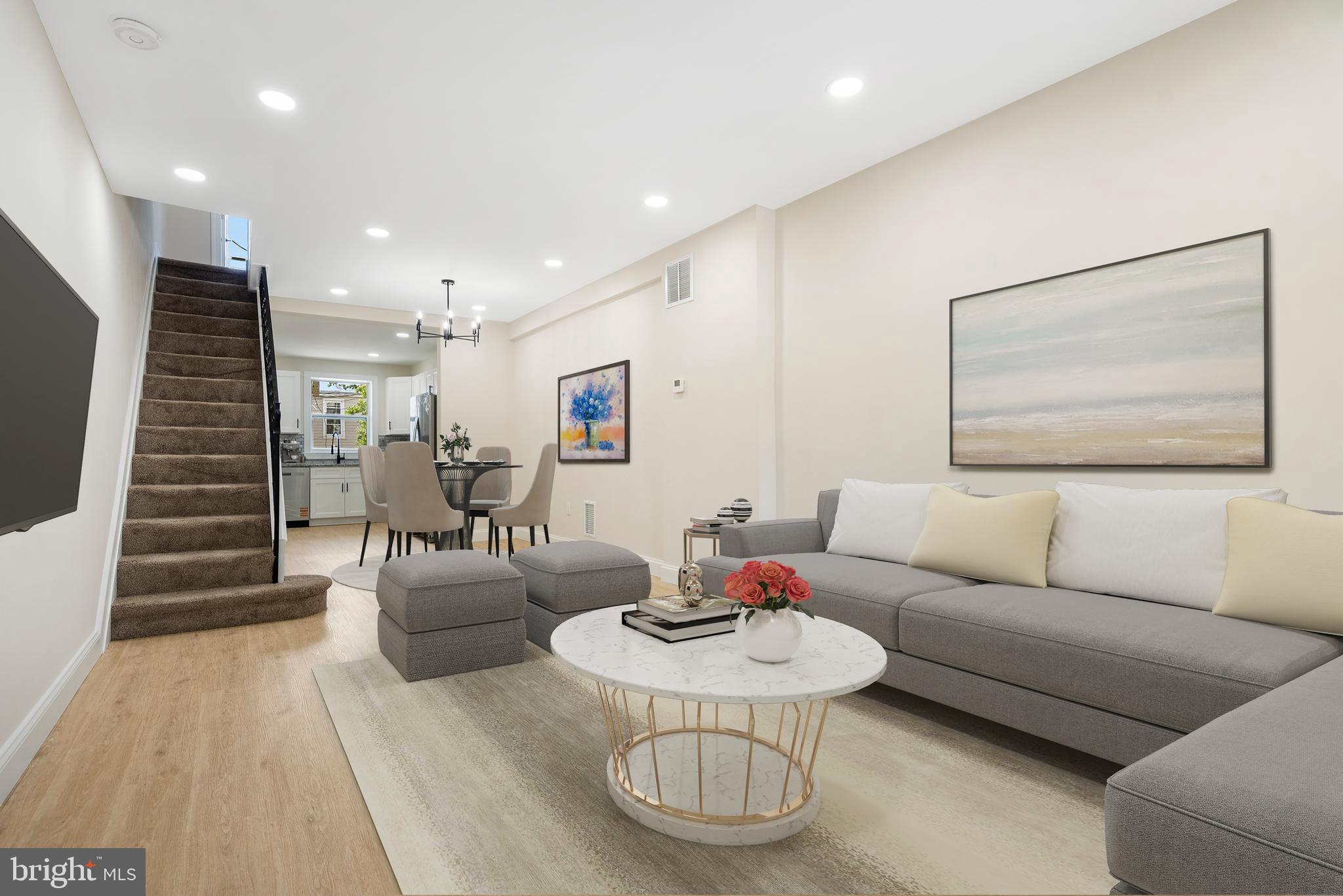 This stunning renovation blends modern finishes with classic Baltimore charm in one of the city's most vibrant neighborhoods. Step inside to find luxury vinyl plank flooring throughout the main level and a bright, open layout perfect for entertaining. The spacious living room flows into a dedicated dining area, leading to a beautifully updated kitchen featuring granite countertops, stainless steel appliances, ample cabinetry, and generous prep space. Upstairs, the primary suite offers a peaceful retreat with a large custom-shelved closet and a private ensuite bath with a relaxing tub/shower combo. A second bedroom, another full bathroom with a custom-tiled walk-in shower, and a convenient laundry area complete the upper level. The finished lower level adds flexible living space—ideal for a rec room, second family room, or home office—plus a powder room and extra storage. Step outside to enjoy summer BBQs in the fenced rear patio, perfect for entertaining. Centrally located just moments from Eastern Avenue, O'Donnell Street, I-95, I-895, Johns Hopkins Bayview, and all the dining and shopping Greektown has to offer—this home truly has it all!