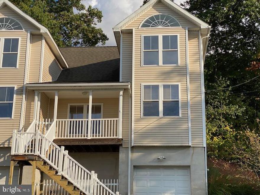 Seeking modern living? Then take a look at this beautiful 3 bedroom, 2 bath townhome setting on 0.14 acre in the highly sought after East Mountain area. This home boasts all the amenities buyers are looking for in today's market, such as gas heat, central air, hardwood and tile floors, granite kitchen tops, 1st floor laundry, and a heated built in garage. (2 smaller SUVs do fit in line) There is a porch in the front of the home with a scenic view of the city and privacy, from the rear composite deck backing up to east mountain to unwind after a tiring day at work. This is a must see and is priced to sell. Come and see if this wonderful property meets your needs. Have your Realtor show you this one, you won't be sorry. Owner is a Licensed Pa. Realtor