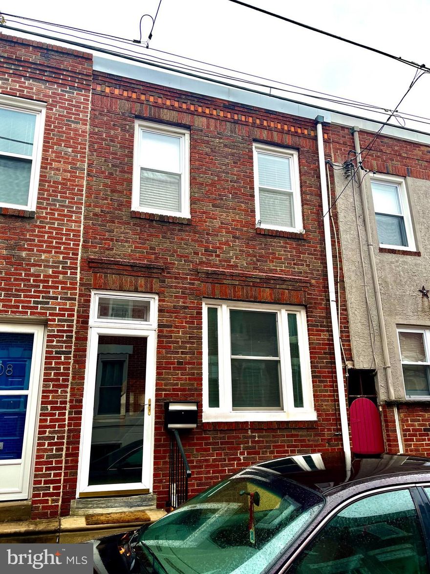Adorable and perfectly maintained traditional stairs up the center row home in Dickinson Narrows. Mr Clean Lived here! Owned by the same person for 28 years, this is a meticulous starter home, fully functioning  and move in ready, but could also benefit from some updates and personalization. Large front window lets light into your living room all day, dining room has a pass through window with wood shelving into the kitchen. Kitchen is large enough to eat in with some rearranging, but has plenty of cabinets and counter top space along with a window and door to your charming outdoor area with a planting bed for flowers.  Upstairs you have a good sized front "master" bedroom and a smaller back room with access to the updated bath with tub shower and pedestal sink. Mini split system installed in 2019 for heat and AC plus, your radiator boiler is also new as of 2019. Hot water heater approx 5 years young, new roof in 2016 with coating in 2020, washer in your clean dry basement with metal shelving and a wooden work table. A fresh coat of paint tops it all off. Come take a look and make this sweet brick front South Philly row your new home sweet home.