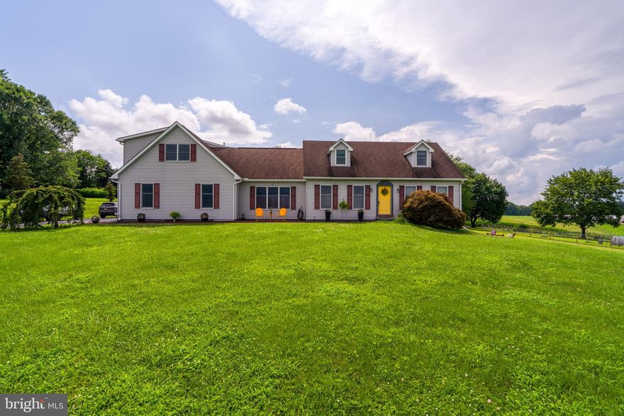 Welcome to this beautifully expanded Cape Cod-style home with 1 Bedroom Apartment above the garage!  This property offers 3,826 total finished square feet of flexible living space on a picturesque 1.07 acre lot. Perfectly blending character and functionality, the main home features 3 spacious bedrooms and 2 full bathrooms, including an impressive 800+ sq ft 2nd-floor Primary Suite complete with a private sitting area, dual vanity bath, and direct access to a private second-story deck—ideal for enjoying the sweeping countryside views.
Entertain with ease in the formal dining room or gather in the vaulted family room, which boasts a dramatic spiral staircase and rich architectural charm. The finished walk-out basement provides additional living space and leads to a serene outdoor seating area, perfect for quiet mornings or evening sunsets.
Step outside and take in the beauty of the surrounding farmland from your two-tiered decks designed for relaxation and panoramic viewing. A 3-car insulated garage offers ample storage, while the separate In-Law Apartment—complete with its own kitchen, living room, bedroom, bathroom, and private entrance—offers the perfect setup for extended family, guests, or potential rental income.
This one-of-a-kind property offers space, comfort, and breathtaking views, all while delivering versatile living options in a peaceful country setting. Don't miss your chance to call this rare gem home!