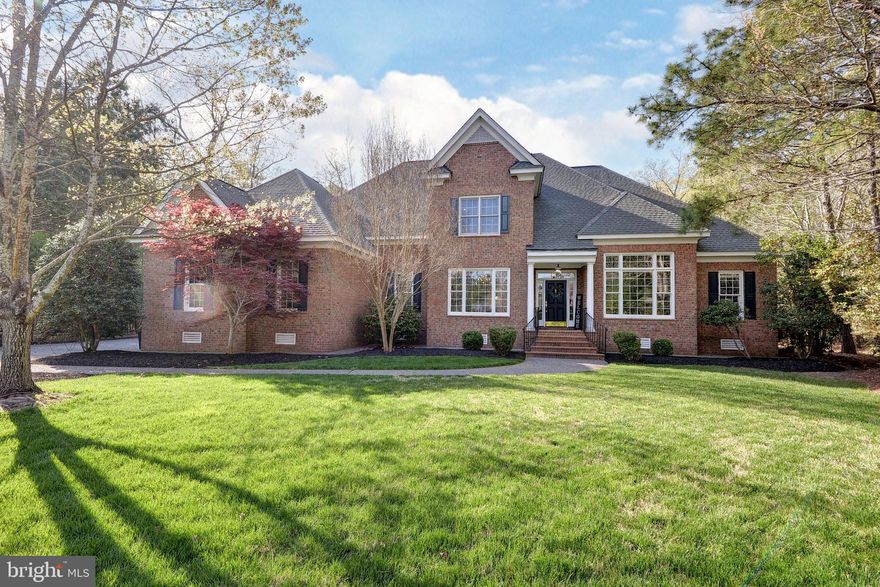 Set at the end of a cul-de-sac on over half an acre in highly desirable The Governor's Land at Two Rivers, this elegant home offers soaring ceilings, beautiful natural light, and a gracious floor plan designed for comfortable living and easy entertaining. Refinished American Cherry hardwood floors and fresh interior paint give the home a bright, refreshed feel. A cozy first-floor office adds flexibility for work or quiet retreat. The spacious kitchen is the heart of the home, opening seamlessly to the family room and screened porch overlooking a secluded rear yard for effortless everyday living and entertaining. Rich millwork, oversized windows, and three fireplaces add warmth and character throughout. A formal dining room is complemented by a separate serving pantry with dry bar, wine refrigerator, and added cabinetry. Upstairs, three well-sized bedrooms and two full baths complete the floor plan. Exceptional walk-in attic space offers abundant storage and future expansion potential!