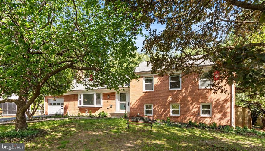 A beautifully updated large home on the end of the street with a large flat backyard and so much privacy—nearly half an acre! This lovingly maintained residence showcases a chef's kitchen with an island, granite counters, stainless steel appliances and more cabinetry and storage than a small restaurant. The wonderful morning room addition has abundant natural light and is a great place to enjoy your morning coffee while looking out into the nature of your expansive private backyard. Hardwood floors run throughout the main level in your large separate dining and living areas, both featuring great windows to the outdoors. The upper level offers three spacious bedrooms and two full baths. The lower above ground level includes a large bedroom, a family room, a full bath with an oversized walk-in shower, and a bright laundry room. There is even another lower level with more rooms!   .. Enjoy outdoor living with a deck, patio, fish pond, shed, and more—perfect for relaxing or entertaining. This home offers both comfort and quality craftsmanship just a couple of minutes from Route 200, New Hampshire Avenue, parks, shopping, and major commuter routes.
