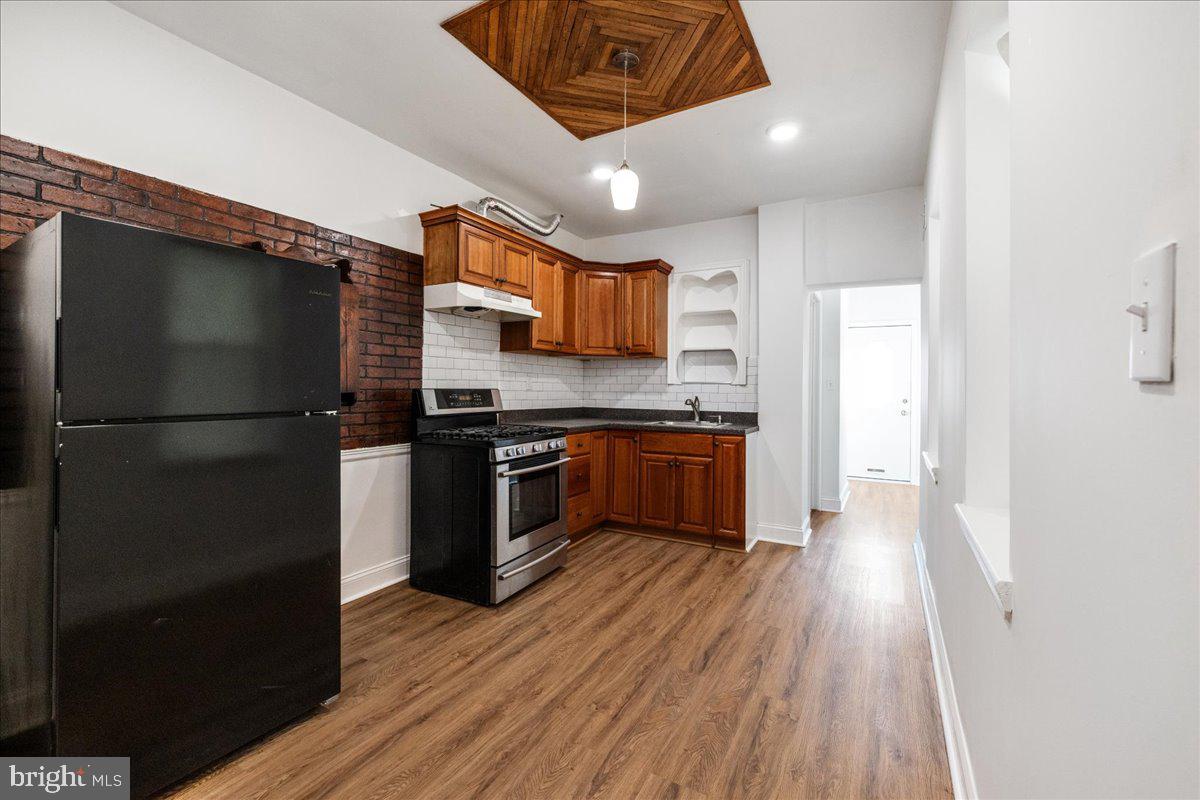 Discover the perfect blend of comfort and modern living in this newly renovated 2-bedroom, 2-bath home. Featuring new floors, updated bathrooms, a new water heater, and central air, this home is move-in ready. The first floor offers a bright, open living and dining area that seamlessly flows into a generously sized kitchen, perfect for hosting family and friends. Beyond the kitchen, you'll find a convenient laundry hookup, a full bathroom, and access to the backyard. Upstairs, enjoy two bedrooms, a full bath, and a versatile office or living area with a charming balcony overlooking the backyard. The open basement provides plenty of flexible space for a cozy hangout or an additional bedroom, complete with a second laundry hookup and washer/dryer. This inviting home is a must-see!