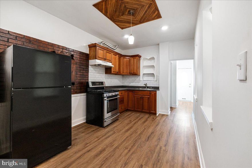 Discover the perfect blend of comfort and modern living in this newly renovated 2-bedroom, 2-bath home. Featuring new floors, updated bathrooms, a new water heater, and central air, this home is move-in ready. The first floor offers a bright, open living and dining area that seamlessly flows into a generously sized kitchen, perfect for hosting family and friends. Beyond the kitchen, you'll find a convenient laundry hookup, a full bathroom, and access to the backyard. Upstairs, enjoy two bedrooms, a full bath, and a versatile office or living area with a charming balcony overlooking the backyard. The open basement provides plenty of flexible space for a cozy hangout or an additional bedroom, complete with a second laundry hookup and washer/dryer. This inviting home is a must-see!