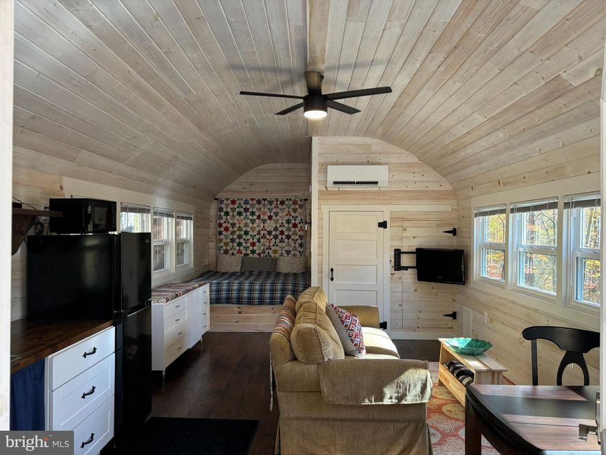 Custom built cabin in the foothills of Great Cacapon WV, just waiting for the new owners to enjoy as much as the current owners have.   If you have to come take a look to see how cute this place is....This cabin has everything you need for your weekend getaway or just enjoy this cozy place while building your next dream home on this lot, which the utilities, including septic system, has already been extended for that. Electric has been installed to the Bunkhouse/Garage to get you started on finishing out for separate living quarters. Internet is installed for your WI-FI phone and to stream movies.  Enjoy sitting around a campfire to the sound of nature.  If you have been thinking about making a move, then this is the move that has been waiting on you.  See additional docs for more information on this quiet and secluded place...Many upgrades including all new windows, instant hot water, and new water treatment system.