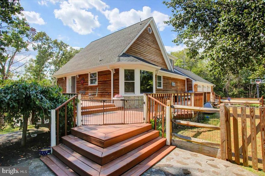 SEE VIDEO TOUR!!!  Tired of the same old cookie cutter homes?  Well, this isn’t one of them!  Situated on an UNRESTRICTED 1.26 acre double lot bordering 235 feet of the Opequon Creek, you’ll find this 3 bedroom, 3 bath, contemporary home offering absolutely everything.  Turning onto Our Lane, you’ll traverse a few turns on a well-maintained ¾ mile gravel road that leads to the property at the end.  Approaching the property, you’ll quickly notice the unique architectural styling, beautiful stained siding, large 3-car garage, additional detached garage/shed, multiple decks and a view of the Opequon Creek.  After parking on the concrete driveway, a quick step onto the large front deck leads to the wrap-around side deck and to the side entrance door.  Entering, you’ll find a freshly professionally painted interior surrounding an open concept foyer/dining/living room combination with vaulted ceilings, large ceiling fan, a pair of pendant lighting fixtures, opposing brick accent walls and a sunken living room area.  You’ll enjoy plenty of daylight from 6 large southwest facing windows as well as a huge arched window, all with beautiful wooden window shutters.  Transitioning to the adjacent eat-in kitchen, you’ll find plenty of oak cabinetry and counter space, a peninsula with room for 4 stools, a prep counter, a complement of stainless steel appliances and a double bowl sink.  The vaulted ceiling continues in the kitchen area as well as the daylight with a large bay window and 2 complementary windows overlooking the front deck and yard.  Just off the living room area, is the main level primary bedroom with adjacent en-suite bath featuring a tile shower with sliding doors.  Adjacent to the primary bedroom is a sitting area with a sliding door to the upper level deck as well as a walk-in closet.  Through the sitting area is a door to the oversized 3 car garage offering 1,200 square feet of parking, storage and workshop area!  Heading back to the living room area and ascending the steps to the upper level is the second of 3 bedrooms with its own attached full bath featuring another beautiful tile tub-shower combination.  A door at the end of the bedroom, leads to two additional attic areas offering nearly 900 square feet of additional storage with drop-down stairs to the garage for access as well.   Adjacent to this bedroom is the third of 3 bedrooms which is a unique loft bedroom.  On your way back down the stairs be sure to stop and check out the perch area overlooking the main level.  Heading down the stairs to the lower level is the ultimate relaxing and entertaining area!  With over 800 finished square feet to offer, this is your family room, theater room, game room or anything your heart desires.  Another full bath with jetted tub is also found on this level as well as a utility and laundry area.  Yes, those full height windows also continue on this level providing plenty of daylight whenever you want it – this isn’t your ordinary lower level!  Now for the ultimate entertainment area . . .  step out the sliding doors and check out the huge rear patio area overlooking the back yard and Opequon Creek.  50 people coming over?  No problem!  Plenty of room for table space, outdoor seating, grills, smokers, flat-tops, firepit or even a future outdoor kitchen.  Head up the steps to the upper level deck (remember, this also leads to the primary bedroom) and take in everything this property has to offer.  Combine all of this with a beautiful detached garage/shed (with electric), a 6 year old roof, 4 mini splits just 3 years old, newer well pressure tank, treatment system and water heater, Leaf Filter gutter protection, newer garage doors and a location away from the ordinary and you may have just found that unique property for which you’ve been looking!