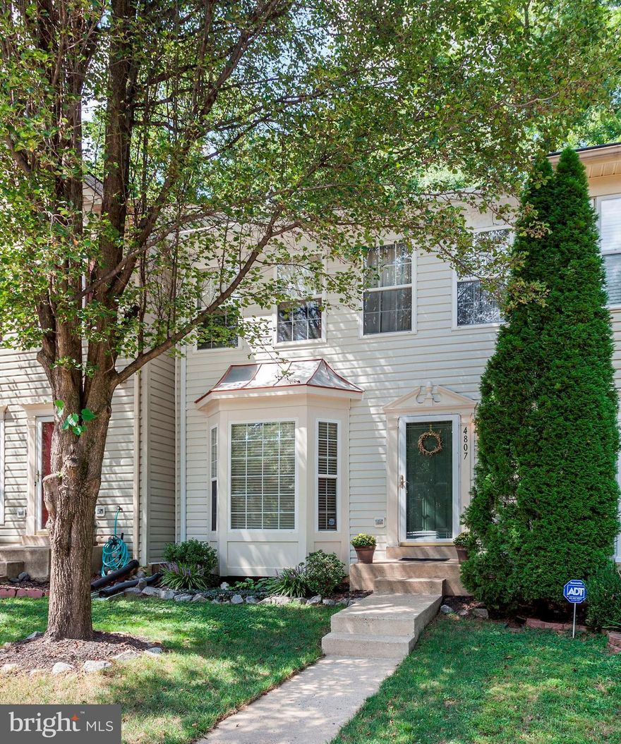 Adorable, lovingly maintained 3 BR, 2.5 BA townhouse located near I-95 & PW Pkwy. Steps away from library, shopping & restaurants. New laminate floors on main lvl. New washer & dryer. His & hers WICs in master BR. LL bonus rm makes great office or den. Prime lot backs & fronts to trees for privacy. Deck w/ fenced yard. Storage chest conveys. Choice Home Warranty transfers to new owner.