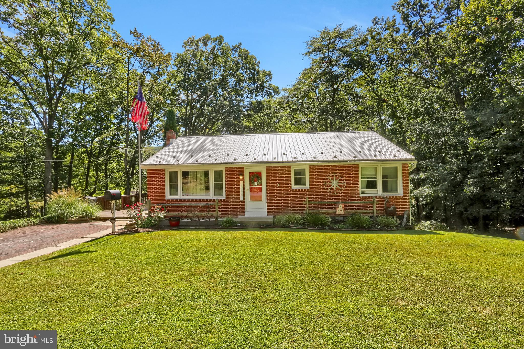 Discover this charming 2-bedroom, 1-bath ranch home set on .71 acres along a quiet back street! Offering peace and privacy with two parcels included- this home is both inviting and practical. Inside, you’ll find an updated eat-in kitchen with all appliances conveying, a cozy living room with hardwood floors, and bedrooms featuring generous closet space.
The large walkout basement boasts tall ceilings and is ready to be finished, giving you plenty of room to expand your living space. Major updates include a newer metal roof, replacement windows, and a radon system already in place for peace of mind.
Step outside to enjoy a large wood deck, perfect for outdoor entertaining or relaxing evenings. The property also features a backyard retreat with a shed, wooded setting, paved parking out front, and additional parking down a private drive. Affordable and semi-secluded, this property is the perfect blend of comfort and opportunity.