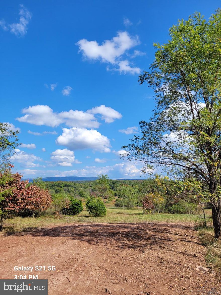 REDUCED!!!  Discover 20.31 acres of land offering both privacy and potential. Approximately 4 acres are wooded, providing a natural buffer and shade, while the remaining acreage opens up to scenic views and space for your dream build. A driveway is already in place with an approved entrance permit, and the property has successfully passed a perc test, making it ready for your new home. No homeowners association restrictions—enjoy the freedom to design your property your way. Ideal building site with beautiful views makes this a prime opportunity for your future home or retreat.