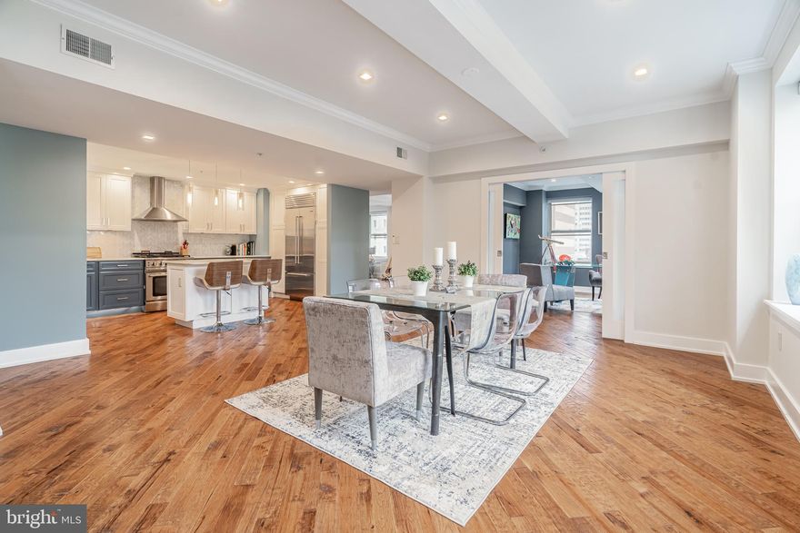 Enter the impressive lobby of this c.1900 Loft Style building via a 24-hr high-tech security system you access from your smartphone. The elevator uses your own personal security code so each owner only has access to their floor. Arrive on the 8th floor to a newly renovated marble tiled hallway which accesses 2 units on the 8th floor and two private storage/laundry rooms. Unit 800 has been meticulously updated – you’ll find an expansive open floorplan, 9.5 ft ceilings with beams, genuine wood walnut floors, 2 bedrooms, 2.5 baths, and an impressive corner office space off the bonus/family room. South and West exposures allow sunlight to drench the interior through the industrial sized windows. Enjoy a chef’s kitchen complete with Miele dishwasher, Capital range, Sub-Zero refrigerator, center island, Marble countertops and custom cabinetry! Luxuriate in the large Primary Suite - with attached bathroom and walk-in closet, nicely tucked away by pocket doors. The en-suite features a large freestanding soaking tub and huge shower, heated floors, towel warmer and large double vanity. The closet is conveniently built out for all your storage needs. Additional features of this unit include a guest bedroom with double closets, hall bathroom with exquisite tilework, recessed lighting throughout, automated blinds, half bathroom, enormous bonus/family room with floor to ceiling built-in shelves, plus a secretary’s office space (with it’s own entrance from the hallway)! With so much space in this unit, this is truly an entertainer’s dream. The possibilities are endless in this unique offering in Center City Philadelphia. Located just one block from Rittenhouse Square and within walking distance of the city’s finest shopping, 5-star eateries, theatres, and concert halls. Included in the sale are two parking spots (tandem) for 1 year. Low condo fees per square foot. Don’t wait, book your private showing today!

Both units on the 8th floor (800 and 801) are also being sold as a package for a slight discount.