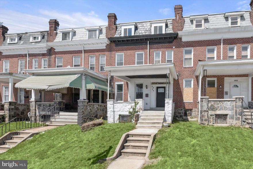 Huge, Four Level, Fully Updated Porch Front Rowhome - SIX TRUE BEDROOMS!  Open Concept Main Level is highlighted by Gourmet Kitchen featuring Upgraded Casework with Crisp White Finish, Granite Counters, Huge Island with Seating, Stainless Appliances & Herringbone Mosaic Backsplash.  Main Level also features Powder Room, Hardwood Floors, Stone Fireplace, Trey Ceilings, Recessed Lighting & Ceiling Fan.  Second Floor Features Primary with En Suite Full Bath and Walk In Closet, as well as 2 Additional Bedrooms and a Hall Full  Bath.  Third Floor with 4th and 5th Bedrooms, Additional Hall Half Bath, and Skylight.  Lower Level with 6th Bedroom, 3rd Full Bath, Family Room, Laundry Room, and Storage Areas.  Fully Fenced Read Yard.  Located across the street from Public Transit.  All Mechanical Systems and Appliances believed to be updated with 2022 Renovation.
