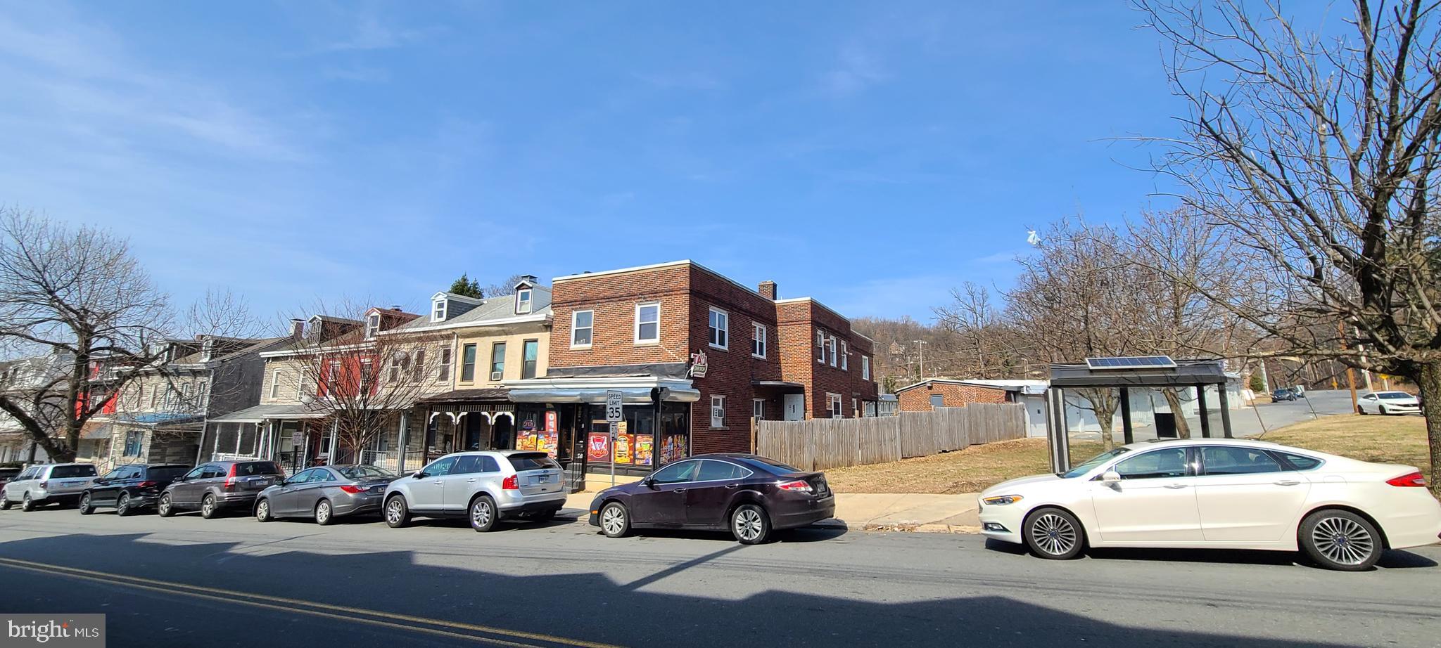This is a 4 unit consisting of three residential units and one commercial type, 700+/- SF store front (presently rented for $800.00 per month) Two one bedroom units on the second floor one rented for $900.00 per month, and one for $1,000. per month. There is also a two story, two bedroom apartment presently rented long term for $1,250.00 per month. This property has been maintained in very good condition, with 4 separate, 100 amp electric services and newer flooring, paint and appliances in the two smaller units. Located in East Reading, close to parks, schools and shopping, these units will be desirable for years to come. NO GARARES ARE INCLUDED AND ARE NOT FOR SALE!! ONLY THE 4 UNIT BUILDING IS FOR SALE.
