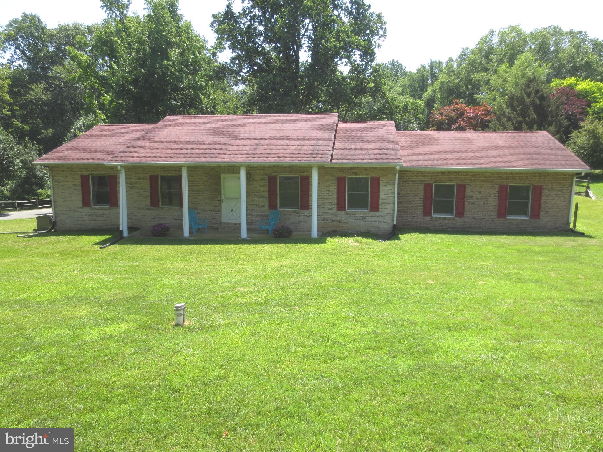 Ready to make some serious equity? This is an extremely well-built 2000 square foot Tennessee brick rancher on a cleared corner, allowing plenty of sun, and a landscaping adventure. This home is surrounded by homes worth from $500k to 1 million plus.
Get your "steps" in with a short walk up the road to the Turkey Point Lighthouse and Wow! what a view. You can store a kayak, relax at the beach or pavilion. and moor your boat all from the Community Common area just a few minutes into the neighborhood. A family could split the master bedroom by adding a wall and door to turn it back to a 3 bedroom as per the original layout and septic volume. The interior is a neutral palette waiting for your taste and talent.
The 200 Amp service, the whole house generator, the newer water heater, heater and water conditioner are serviced yearly, and the 525 square foot carport has a 6-inch slab which opens up the possibility to enclose it as a garage if one likes. A little attention will go a long way.