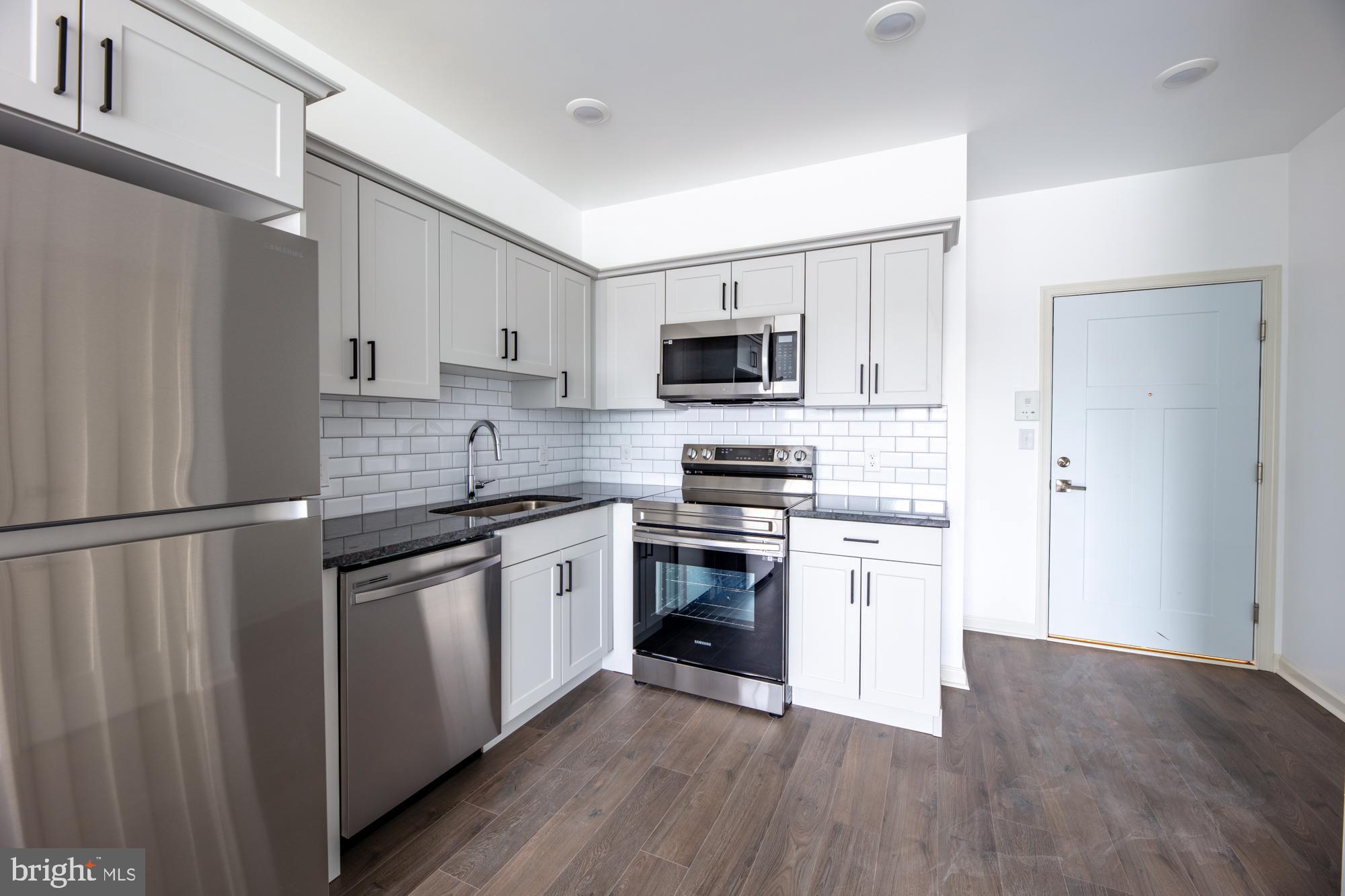 Available Now! Spacious & Modern Two-bedroom apartment home! Come home to Wood Norton, nestled among the trees on a quiet block in Germantown-Mt.Airy. Convenient to the Chestnut Hill West SEPTA line and Wissahickon Park! Your new 1-bedroom home features a fully-equipped island kitchen with custom granite countertops, stainless steel appliances, and soft-close cabinetry. The main living area features open concept living & oversized windows let in beautiful natural light. Chores are a breeze with easy-to-clean wood-inspired flooring, and your own washer/dryer! Keep cool year-round with PTAC Climate control in every room. Shield your car from the elements with on-site garage parking (additional fee). Easily pay rent and submit service requests online with our resident portal. Plus, your new home is 100% pet friendly with NO PET FEES! This brand new home will not last long - apply today!