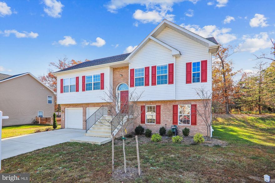 HOME COMPLETED IN 2022.  Easy commute to JB Andrews, DHS and Coast Guard Headquarters, and the DC Metro area.  This amazing split-foyer home features 3 bedrooms, 3 full baths, and an incredibly large eat-in kitchen.  The home has a brick front and a fully finished, insulated 2-car garage.  The interior features triple crown molding, recessed lighting, 9-ft ceilings, ceramic tile in the bathrooms,  and quartz countertops and 42" cabinets in the kitchen.  There is a large upper-level family gathering room and an additional generously sized family room on the lower level. The primary bedroom and an additional bedroom are on the upper level, and an alternate primary bedroom with full bathroom is located on the lower level. Relax in the back yard overlooking the tree conservation area.  There is minimal drive-by traffic since it is only four houses from the end of the street.  If you don't want to wait for new construction, this is the place! Convenient to Washington, DC; Alexandria, VA,; Joint Base Andrews; and Coast Guard and DHS Headquarters.