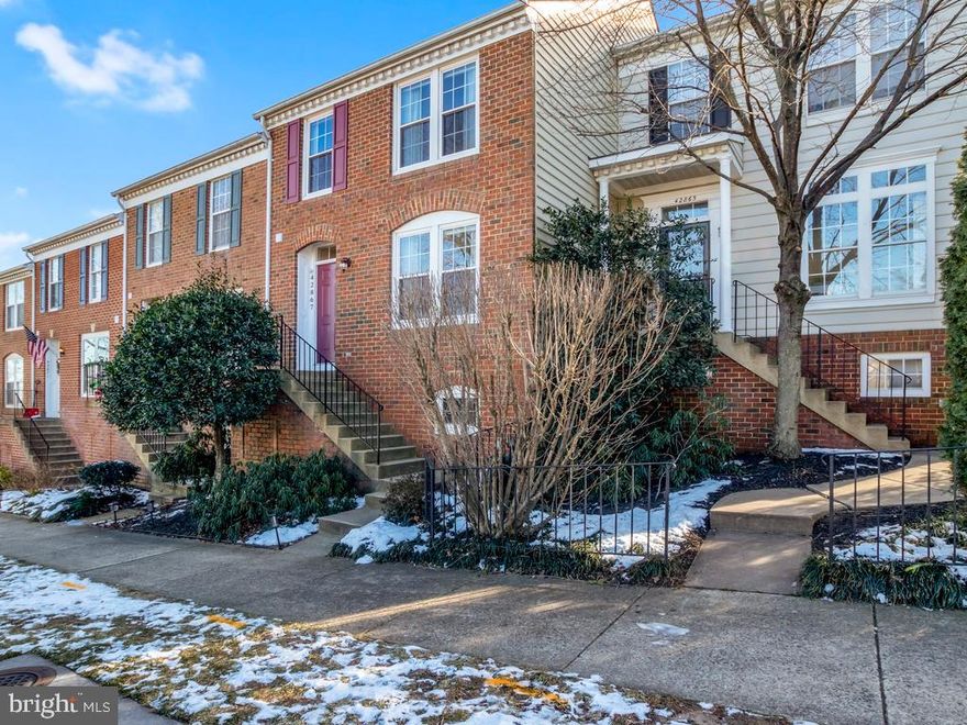 A must see! Wonderful Former Model Townhome in desirable Belmont Forest community!Gourmet Kitchen with stainless steel appliances, granite countertops, white cabinetry, accented backsplash, and center island. The main level has beautiful hardwood flooring and recessed lighting in the living, dining and breakfast areas. 
From the kitchen, walk out to the large 10x10 deck that has a sun setter awning, perfect for relaxing and entertaining. The upstairs has a primary bedroom with a walk in closet a private bathroom with a tub.  The secondary bedrooms share a bathroom. The bedrooms are carpeted with ceiling fans (two rooms) and window treatments. Finished walkout lower level has a cozy family room with a wood burning fireplace and an Office/ bonus area.  From the lower level walk out to a brick patio and lovely small yard. The detached 2 car garage is has electricity and plenty of storage. Upgrades include, 2021 brand new stove and washer, All Bathrooms have been recently renovated and Home was been freshly painted in 2020,  sliding glass door with built in blinds 2013, windows replaced in 2011 and are under warranty, garage roof and siding installed in 2006, HVAC and water replaced in 2010,  Shops and restaurants nearby. Easy access to Toll Road, Rt 28 and Rt 7 and Dulles Airport.  Enjoy WO&D and Trailside Park. Welcome Home!