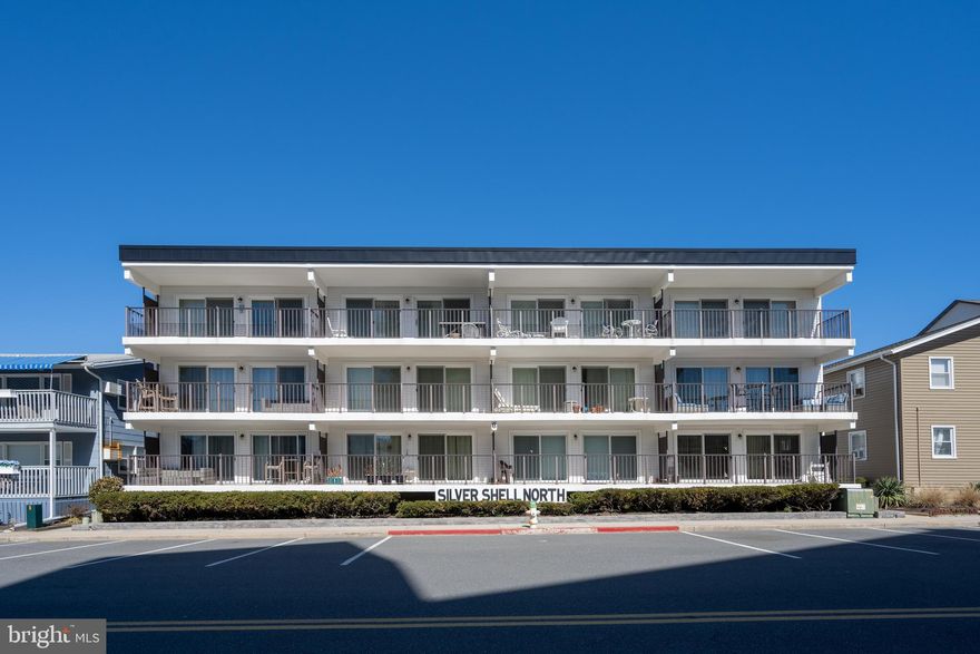 Welcome to Silver Shell North, a BEAUTIFUL 12 UNIT BUILDING. These units are rarely available. Second floor EAST END CORNER UNIT closest to the beach with a 22 foot south facing private balcony that is perpendicular to the ocean with unobstructed views. Views of the ocean from inside the unit.  2 bedroom, 2 bath with 2 parking spots located privately behind building. Never rented. Completely remodeled interior. New water heater in 2019, HVAC 2016, new main water shut off valve, Two 8-foot sliding glass doors (transferable lifetime warranty), new appliances, new soft close kitchen cabinets and drawers, granite countertops. Building recently had a $170k renovation in 2021 that includes: new roof, new siding, new outdoor shower, new hardscape, landscaping and all new lighting around the building. Buildings electrical panels, breakers and meters all replaced in 2021. All new shut off valves in the basement in 2021. New dumpster in 2022. Sidewalk concrete replaced and stairwell floor concrete replaced with new drain in 2022. LOW CONDO fees, strong reserves, and no special assessments. Parking lot is getting patched, resurfaced and parking spots re-striped in April 2023. If looking to rent, 30k plus rental potential. Desirable location in quiet north Ocean City off of Wight St. Walking distance to restaurants, Fenwick, and surrounding Delaware beaches. Plenty of free street parking. Full basement for additional storage. Nothing to do but decorate and settle in to your new beach home.
*Be sure to click on the video link at the top for a great view of the property