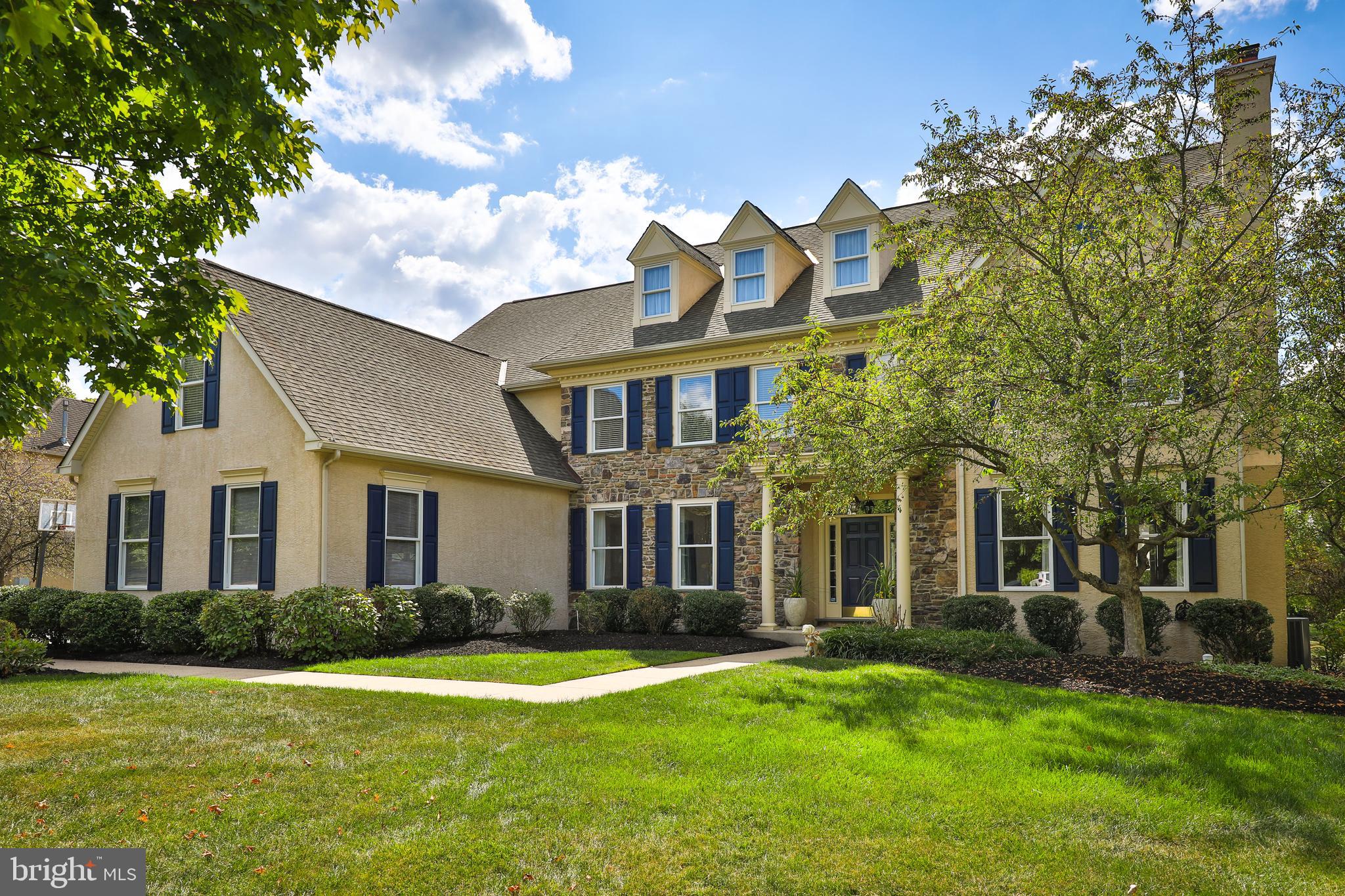 Just listed in Lower Gwynedd Township! Located in the sought-after Spring House Farm neighborhood, this Guidi-built Colonial Farmhouse offers over 6,000 square feet of living space, including a partially finished basement with a full bathroom and ample unfinished space for a future home gym, wine cellar, or private movie theater. The home’s prime location provides easy access to the YMCA and nearby walking trails, making it ideal for those who enjoy an active lifestyle and the natural beauty Lower Gwynedd offers.
Designed with flexibility in mind, the home features a main-level suite perfect for multi-generational living or an au-pair arrangement. Step inside to a gracious two-story foyer with high ceilings and newly refinished hardwood flooring. Two gas fireplaces—one in the Family Room and another in the Living Room—add warmth and charm to the interior spaces. The expansive kitchen includes a breakfast area, a large walk-in pantry, and a Butler’s Pantry, making it a dream for entertainers. Flow seamlessly into the elegant formal Dining Room or gather in the spacious Family Room, which features vaulted ceilings and custom built-ins. A home office on the first floor, complete with glass-paneled doors, offers a private workspace. Upstairs, the primary suite boasts an enormous walk-in closet and an en-suite bathroom with a stall shower, jetted tub, and dual vanities. Four additional bedrooms are thoughtfully arranged, with two sets of Jack-and-Jill bathrooms. A bonus room off one bedroom provides even more flexibility, perfect for use as a playroom, home office, or extra storage space. Outside, the maintenance-free deck and patio provide the perfect backdrop for creating your own backyard oasis, while the three-car garage offers ample storage. The home is equipped with a built-in house generator for peace of mind and an irrigation system to keep the grounds lush and beautiful. A three-car garage provides ample storage. Located in the top-rated Wissahickon School District, with easy access to the Springhouse Shopping Center, major highways, and commuter rail options, this home offers the perfect blend of convenience, lifestyle, and luxury. Call today to schedule your private tour!