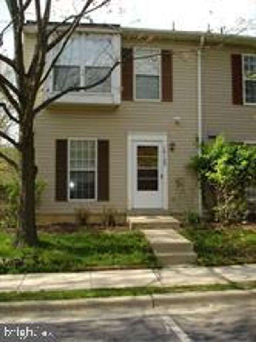 Light and bright updated end unit townhome.  Three finished levels.  Stainless steel appliances and granite counter top.  Deck off the living room.  Three bedrooms upstairs, recreation room/play room in lower level plus full bath and laundry.  Backs to trees and common area.  This is a small enclave of townhouses among larger single family detached homes.  Two assigned parking spaces.  Close to shopping, restaurants and major highways.  The grass area is maintained by the HOA.