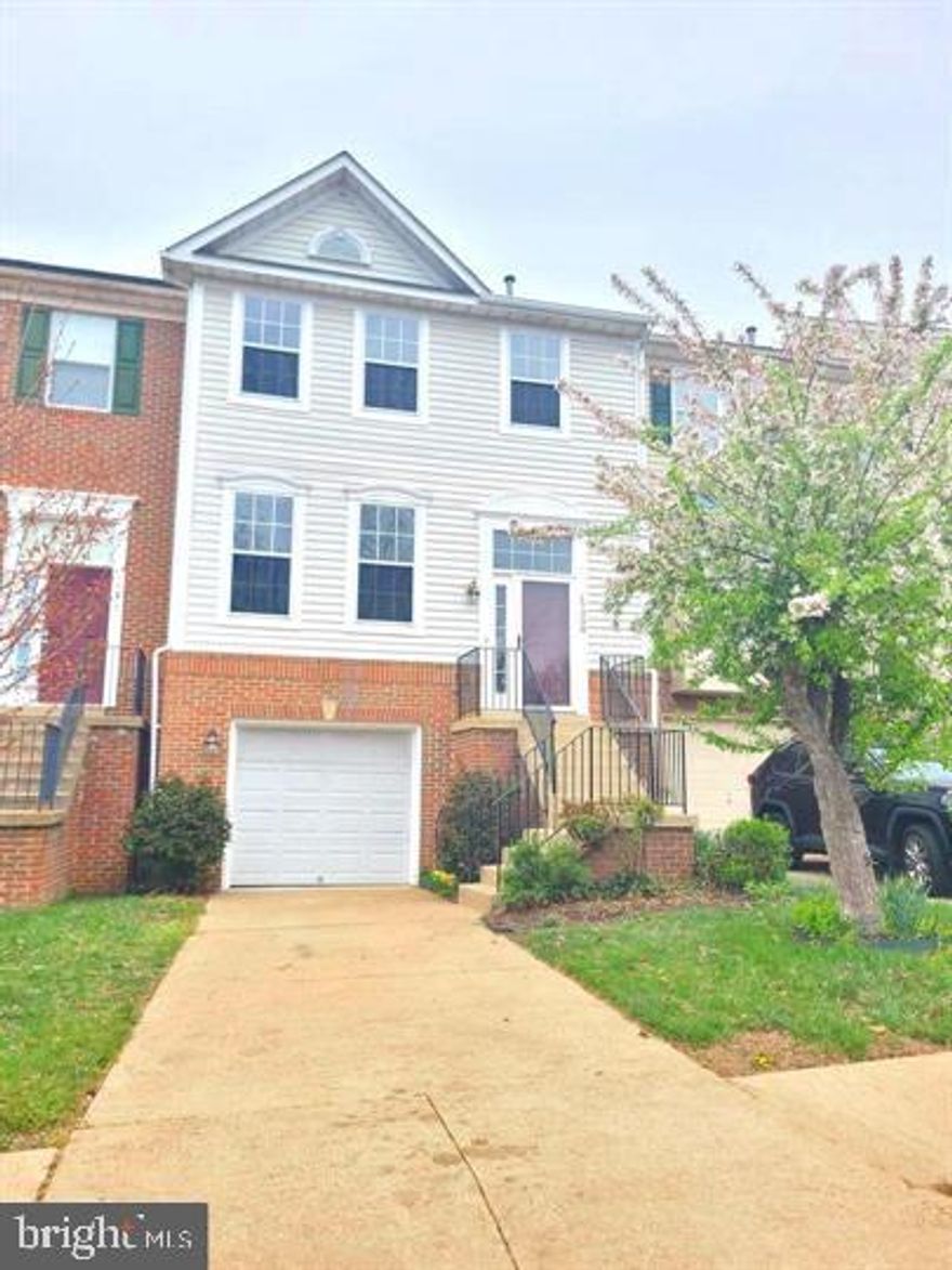 Welcome home to this beautiful and spacious townhome located in the heart of the Forest Park community! This home features fresh paint throughout, stylish new light fixtures, and laminate flooring. The recently updated hallway bathroom adds a modern touch. Enjoy the expansive living and dining area complete with a custom built-in bookcase, elegant crown molding, and decorative stair railings. The kitchen offers a cozy eat-in space and stainless steel appliances. The master bedroom boasts a vaulted ceiling, a walk-in closet, and a generously sized en-suite bathroom. Additional updates include a newer roof and water heater, brand new sliding door in the basement.  Conveniently located near shopping centers, I-95, and surrounded by ample street parking. Backs to peaceful wooded views. Must see!