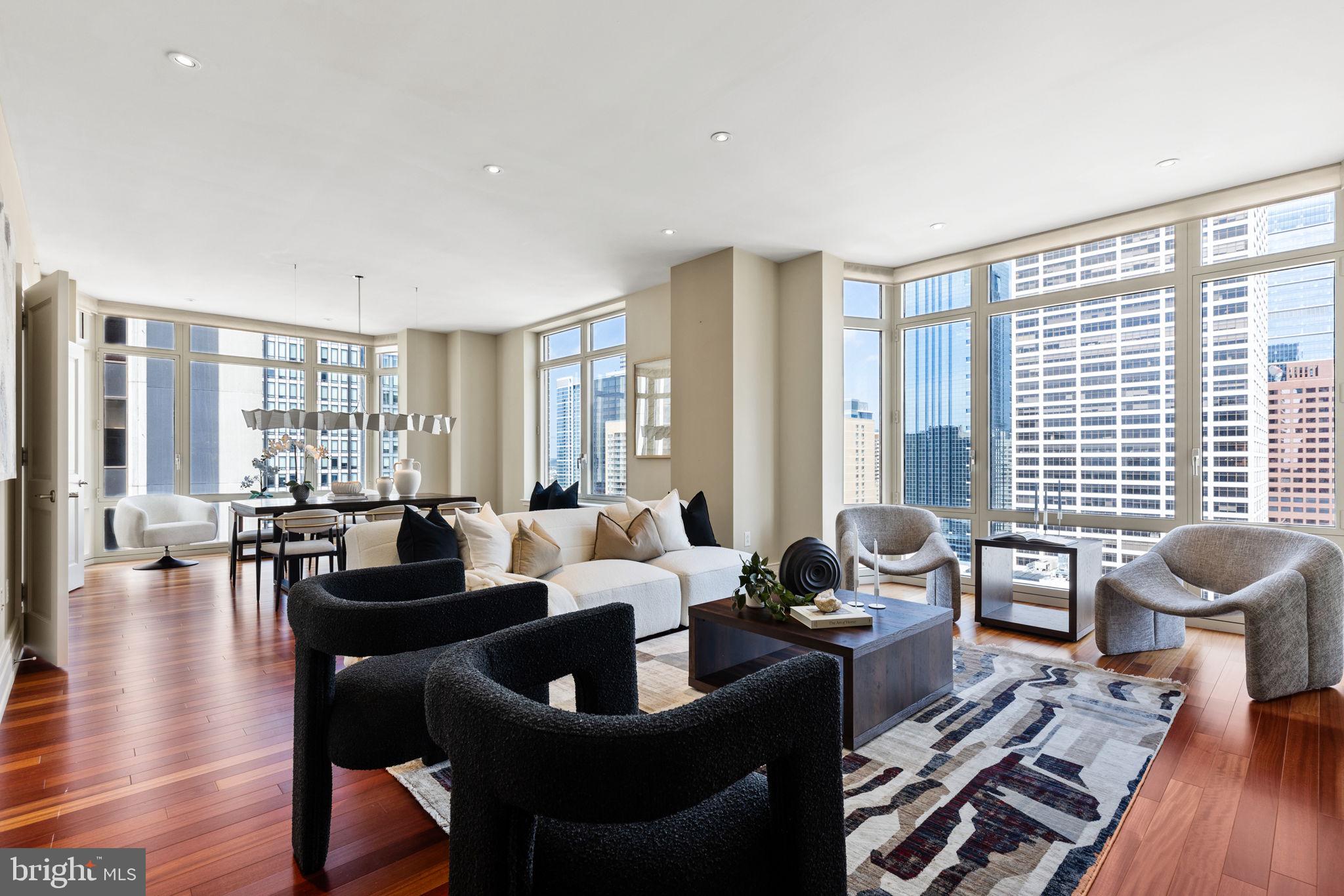 Experience 10 | Live at 10. Welcome to residence 2001 - a deluxe 2 bed 2.5 bath condo measuring roughly 2300 Sq Ft. This Double Corner high-floor residence spans around both the north and south western corners of the building giving you both Skyline and Rittenhouse Square views! A luxurious layout with the right proportions throughout. The great room offers the perfect living and dining combination and features a set of bay windows, gracious wall space and stunning skyline views through oversized windows. Adjacent through french doors you'll find a large eat-in Poggenpohl kitchen with a lineup of high-end appliances, a center island, plenty of prep space for any chefs out there and a breakfast area. The kitchens positioning delivers a terrific circular flow through 2 large openings that you'll really appreciate when entertaining guests. An elegant gallery hall houses the powder room and separates the entertaining areas from the bedrooms. The en-suite guest bedroom is currently used as a den & office but its size offers plenty of optionality. Continuing down the hall through beautiful cased openings you'll enter the primary suite which features a covered deck overlooking Rittenhouse Square (for any morning coffee lovers), 2 built-out walk-in closets and a 5 piece marble bathroom. Additional condo features, to share: hardwood floors, custom built-ins, brand new carpet (in bedrooms) and recessed lighting. What you'll love? The graceful floor plan, natural light, closet space, a terrace you can actually use and the privacy & quietness of the Western side. Robert A.M. Stern, the famed architect responsible for iconic buildings such as 520 Park Avenue, 220 Central Park South and 15 Central Park West designed a masterful building on our beloved Philadelphia park. Residents enjoy 5 star 24 hour service, a chauffeured driven town car, yoga room, gym, indoor lap pool, library, outdoor courtyard, board meeting room, piano lounge, TV lounge, climate controlled wine room, bike storage, catering kitchen, hotel guest suite, underground valet parking and most importantly a friendly and beautiful community. Philadelphia's TOP SPA, Rescue Spa has opened in the building for the ultimate convenient amenity! Pet friendly. ****** Located on prime 18th street where the best restaurants in town are at your finger tips. Pet friendly. One Storage unit included with this sale as well as One Parking License.