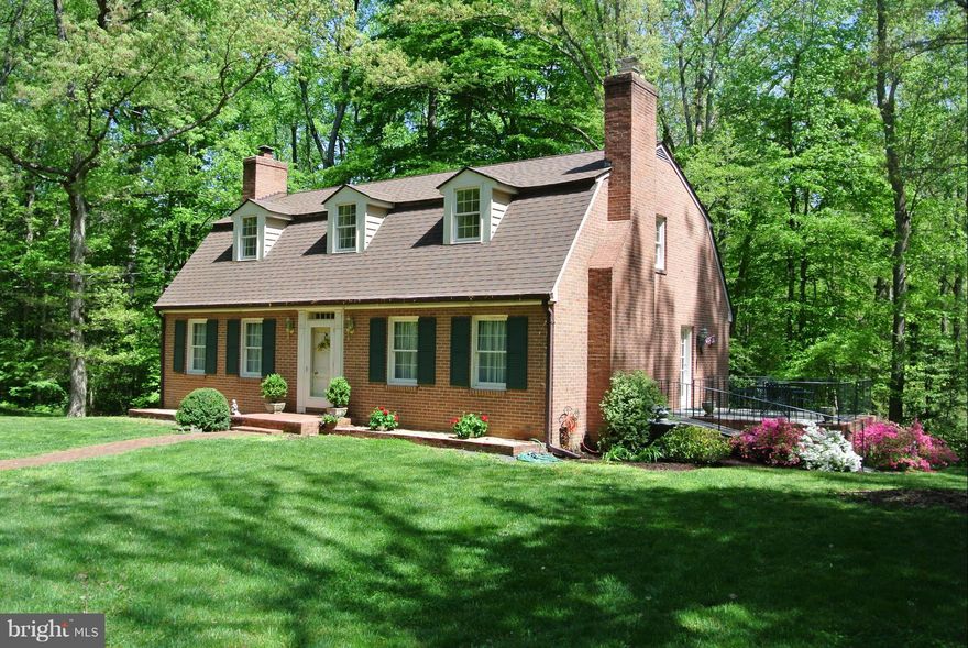 Immaculate home on beautiful lot. Minutes from local commuter lots.  Close to shopping & schools.  Spacious rooms, gleaming hardwood floors, Large slate patio in rear.  Raised brick terrace on side.  Perfect for outside entertaining or enjoying natures beauty.  Tastefully decorated. Colonial charm.  Standard Sale.  All Brick Construction.  Roof one year old. 100% Financing Available.