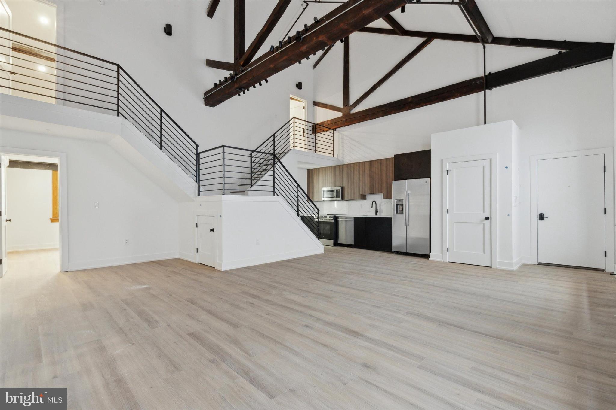 808 N 3rd St is a new 29-unit residential complex in the heart of Northern Liberties. This unique project blends a stunning renovation of the historic Mifflin School with a modern addition of brand-new apartments. Experience spacious, modern designs and coveted city conveniences like keyless entry, private outdoor spaces, and in-unit laundry. Plus, enjoy being just steps from the vibrant shops and restaurants on 2nd St! Unit 27, located on the Schoolhouse 3rd Floor, is a rear loft featuring exposed wood beams, soaring vaulted ceilings, large historic windows, and bi-level design that truly maximizes your space and privacy..