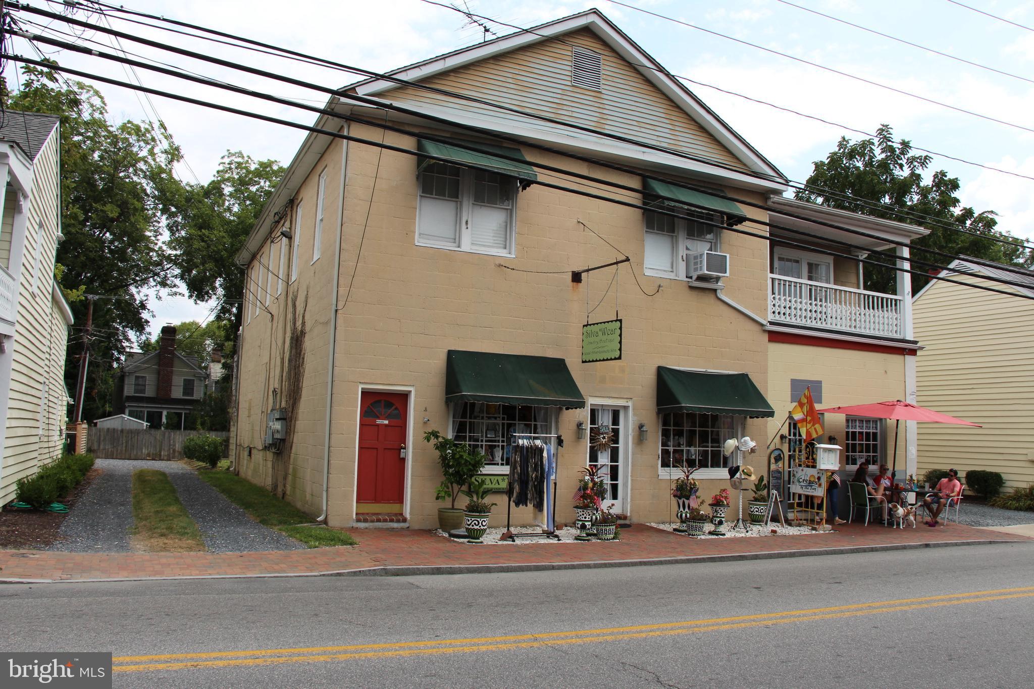 2nd floor apartment over commercial space. 2-3 bedrooms with two bath. Wood floors thru out. Good credit and references required. No pets! Minimum 12 month lease, available end of December 2019.