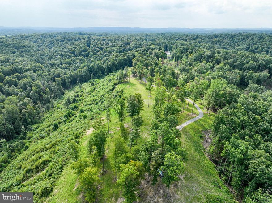 Nestled near the stunning Summersville Lake and the legendary Gauley River, this prime residential lot offers an unparalleled opportunity to build your dream home in the heart of West Virginia's most exciting outdoor playground. Located just minutes from the vibrant town of Fayetteville—hailed as "The Coolest Small Town in America" by multiple publications—this property combines the tranquility of nature with the convenience of nearby amenities. The lot features level build sites that are ready for construction, all with breathtaking views of the Meadow River and the surrounding mountain landscapes. Imagine waking up each morning to the serene beauty of the Appalachian Mountains, with endless recreational possibilities right outside your door. For adventure sports enthusiasts, this area is a paradise. Whether you're into rock climbing, whitewater rafting, or mountain biking, you'll find world-class opportunities just moments away. The nearby national forest adds even more to explore, offering hiking trails, wildlife watching, and the peace of nature. This property is more than just a place to build a home—it's an invitation to embrace a lifestyle of outdoor adventure, natural beauty, and small-town charm. Whether you're seeking a weekend getaway or a permanent residence, this lot near Summersville Lake and the Gauley River is a rare find in one of West Virginia's most sought-after locations.