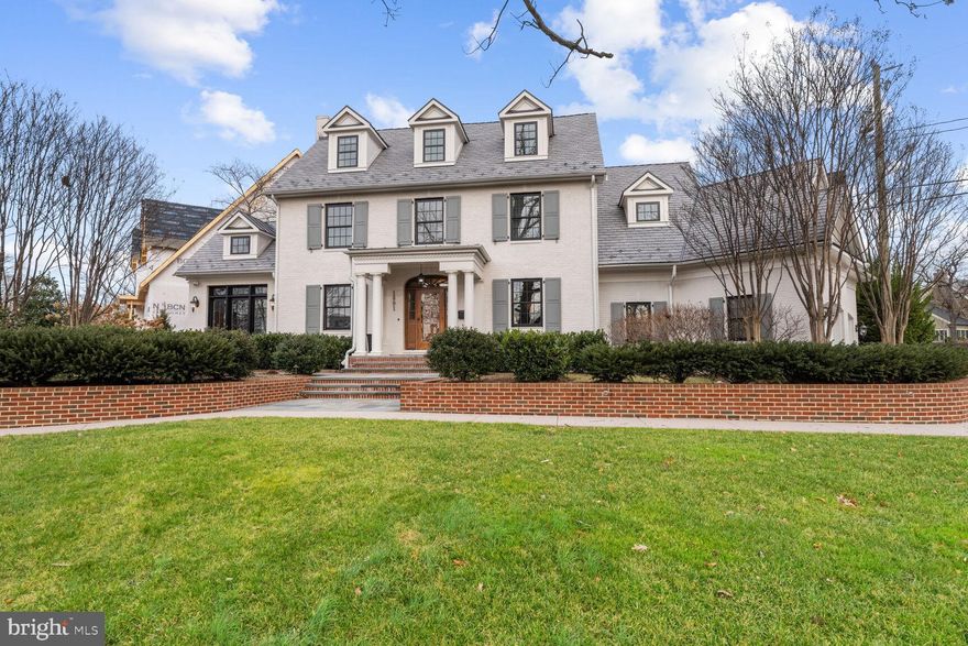 PRICE DROP!  Boasting with charm  and curb appeal, this luxury home blends classic architecture with a modern floor plan and is located in the highly desirable, Lyon Village neighborhood of North Arlington. Welcome to 1801 North Herndon St, a beautiful custom colonial fully renovated and expanded by BCN in 2016 on a .25 acre lot that was meticulously crafted and designed by landscape architect Scott Brinitzer.  Sitting proud on a corner, the home boasts 5 bedrooms, 5 full baths, 3 gas fireplaces, a two car side-loading garage, over 6500 finished square feet, a front private dining patio and a back patio with a built-in gas fireplace. This gorgeous sun-filled home is the quintessential offering of classic architecture coupled with modern elegance. The wide center hall foyer welcomes you to the gracious living space flanked with arched openings to the formal living room and formal dining room. Both rooms are appointed with crafted moldings, custom window coverings and large picture windows that bring the outdoors in. The main level enjoys a gourmet chef’s kitchen with wolf appliances,  custom cabinetry and luxuriant island space, which opens to the family room centering around a modern gas fireplace flanked by a wall of windows that opens to the private outdoor patio. Off the family room, the mudroom doubles as a large laundry room with floor to ceiling built-ins, a secondary pantry with custom shelving and beverage fridge. Additionally, a handsome study is located off the front living room showcasing floor to ceiling custom wood built-ins, vaulted ceiling and access to the front patio. The upper level boasts a beautiful and spacious primary suite with vaulted ceilings, custom window treatments, an incredible en-suite bathroom with glass-enclosed shower, oversized soaking tub, skylights, and an expansive walk-in closet with built-ins, floating island storage and dressing area. Two additional bedrooms, all with en-suite baths are also found on this level. The third level houses the 4th bedroom suite with a walk-in closet and full bathroom. The lower level features an incredible entertaining space with gas fireplace, game area, workout area and seating for even the largest of gatherings. A fifth bedroom with en-suite bathroom along with a wine room and additional storage space are all on this fabulous level. Other interior features are heated floors on the main level and primary suite, built-in speakers indoors and outdoors, new privacy fencing, architectural slate style 50 year roof, irrigation system and a dedicated outdoor gas line for grilling.  Outside, the private yard hosts a lovely rear patio with built-in gas fire pit, plus a large private front patio perfect for outdoor dining. The home’s fine craftsmanship is accentuated by designer architectural detailing throughout and around the sweeping grounds.  Combined, these elements create a one-of-a-kind offering in one of Arlington’s most coveted neighborhoods.  Hands down this house is a 10+ with the most stunning curb appeal in Lyon Village.
