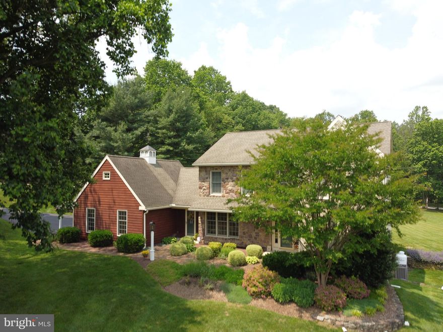 Expansive Colonial on Over 2 Acres in East Coventry Township.  Set in a gorgeous, park-like setting on just over 2 acres, this beautifully maintained Colonial offers the perfect blend of elegance, comfort, and space. Mature landscaping, lush lawn areas, and a serene backdrop make this property feel like a private retreat; yet it’s just steps from Ellis Woods Park with its 70+ acres of preserved trails and recreation.
   A grand two-story foyer welcomes you inside, where gleaming hardwood floors lead to the home’s inviting living spaces. The formal living room features a cozy gas fireplace and an abundance of natural light. The formal dining room is equally impressive—perfect for hosting gatherings in style.  The first floor also features a library/office with privacy door and built in bookcases.  This room could also serve as a 5th bedroom if desired.  
   The spacious kitchen boasts stainless steel appliances, extensive cabinetry, and a peninsula island for additional prep and seating. A bright breakfast area offers beautiful views of the rear.  The family room, also with a gas fireplace, provides another inviting space for everyday living.
Step outside to the rear paver patio, ideal for relaxing or entertaining outdoors.  A large, automated mechanical awning offers shade on warm summer days. Relax, stay cool, and take in the peaceful views of the expansive lawn and mature landscape.
   Upstairs, the generous owner’s suite offers multiple closets and a recently renovated en suite bath complete with a soaking tub, walk-in shower, and oversized vanity. Three additional well-sized bedrooms share a recently updated hall bath.
   The unfinished walkout basement offers a blank canvas for your vision—whether it’s a home gym, media room, or extra living space.  The walkout door provides natural light and easy access for all your needs.
   Lovingly cared for by its current owners, this home is move-in ready and full of potential. With its prime location, beautiful setting, and timeless design, it’s an unbelievable opportunity to own a truly special property in East Coventry Township.