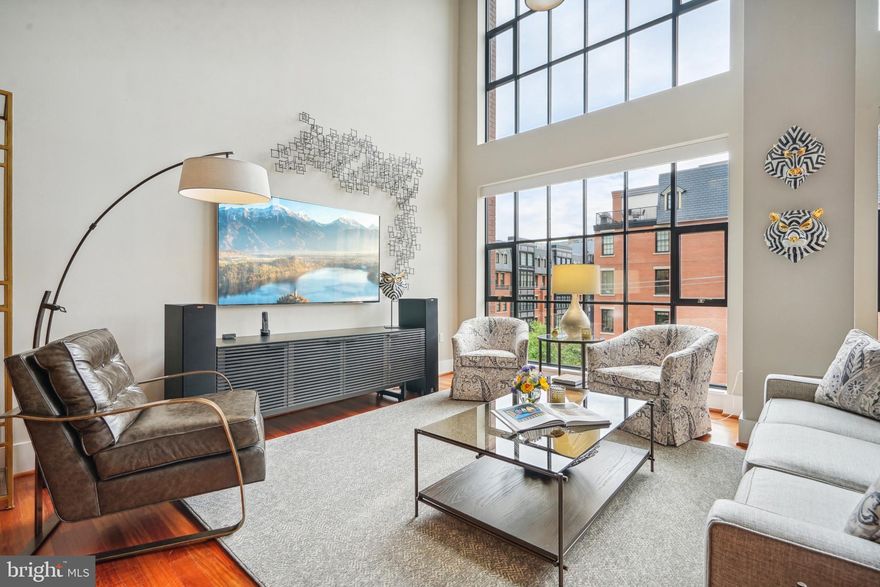 Unique Opportunity at Wooster & Mercer Lofts Experience luxury living in this recently remodeled 2,170-square-foot loft condo, a rare offering in the exclusive Wooster & Mercer Lofts. 

This stunning home features: 
• Abundant Natural Light & Modern Design: A two-story wall of windows floods the space with natural light, featuring contemporary exposed ductwork and a striking floating iron staircase to the second level. • Generous Living Space: Includes 2 bedrooms, 2.5 bathrooms, and a versatile loft area, ideal for a home office. 
• Sophisticated Finishes: Brazilian cherry hardwood floors throughout, fully renovated bathrooms, and an updated gourmet kitchen with Wolf and Sub-Zero stainless-steel appliances and granite countertops - perfect for entertaining. 
• Ample Storage and Parking: A walk-in pantry, two deeded parking spaces, and a large, humidity-controlled, well-lit storage unit with built-in shelving. 
• Recent Upgrades: Two new Carrier air conditioner units (2022) and two new Carrier furnace units (2023). 
• Convenience: Elevator access to the second, loft level. Building Amenities: •
 On-Site Community Manager 
• Swimming Pool & Sun Terrace 
• Central Courtyard 
• Fitness Center 
• Club Room 
• Secure Underground Parking & Bicycle Storage Condo fees cover, among other things, gas (heating and cooking), hot and cold-water utilities, and high-speed internet. 

Prime Location: 
• Convenient Access: Close to Metro stations, restaurants, grocery stores, pharmacies, US post office, and Georgetown shopping and dining. Public transportation options and short driving distances also make accessing these amenities easy and convenient. 
• Excellent Connectivity: Easy access to highways US-50, I-66, and I-495 beltway, and less than 4 miles to Washington National Airport. Don’t miss this rare chance to own an incredible loft in one of Washington's most sought-after locations.