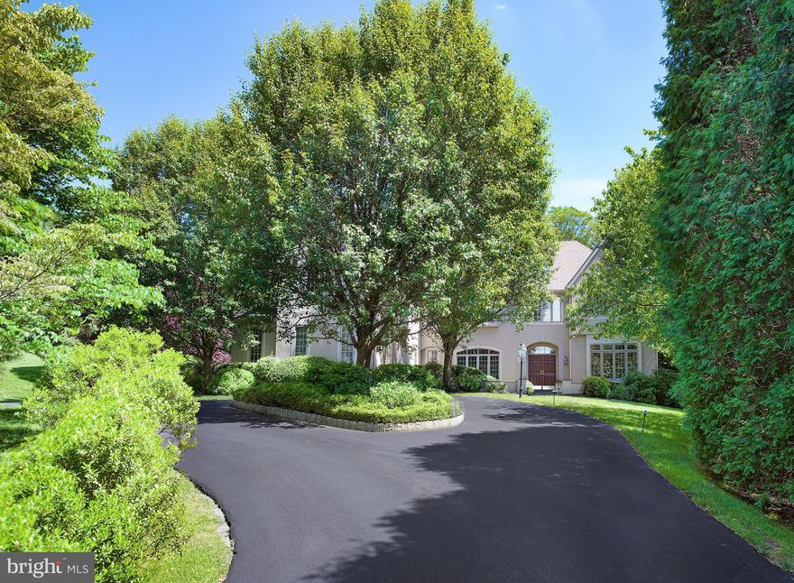 A grand home worthy of the discerning buyer s attention, this Bryn Mawr beauty sits on a pristinely landscaped 2.9 acre property highlighted by mature trees, lush plantings and blooming gardens, affording a most picturesque, private setting. Set back from the road on a lovely cul-de-sac, the magnificent parklike environs features a lifestyle enhanced by sprawling lawns, an expansive flagstone patio, lovely hardscaping, a large heated rectangular swimming pool , three-room cabana with two-full baths, and a lighted tennis court for the ultimate in outdoor enjoyment. Yet minutes away are conveniences such as top schools, shopping, restaurants, the train station and easy access to I-476. A circular driveway leads to a flagstone walkway and courtyard that welcomes you to the interior of the home through double mahogany front doors at the covered entry. The impeccably designed interior is as impressive, warm and welcoming yet elegant and upscale, made so by open arches bathed in natural light by abundant windows on all sides and a seamless layout for the ultimate in indoor-outdoor living and entertaining.  The interiors are enhanced by gleaming oak flooring, handsome millwork, tasteful finishes & custom built-ins throughout. Beyond the main entry doors, a spacious center foyer flanked by open arches leads through rear double French doors to a large flagstone patio, Viking gas grill & dining area for summer cook-outs and family gatherings. A comfortable formal living room and sophisticated dining room, both with gas fireplaces, provide the ideal flow and setting when hosting guests. Connecting the dining room to the spacious kitchen is a butler s pantry and wet bar for easy serving. Tailored to the cook and functioning as the heart of the home, the impeccably-designed gourmet kitchen is appointed with granite counters & large center island made for congregating.  Top-of-the-line appliances include a side-by-side Sub-Zero refrigerator/freezer & Viking range. Adjoining is an open vaulted sun-bathed breakfast room with triple walls of windows, perfect for savoring both meals and views of a landscaped rock wall, outdoor terrace and rear grounds. The large family room, where the kids can watch TV while meals are being prepared, is highlighted by a double sided fireplace, oversized window and custom-built cabinetry.  Also on this level are a library/game-room, formal powder room, and a second powder room off the mudroom that accesses the 4-car attached garage. A majestic staircase rises to a sun-filled upper landing introducing five spacious bedrooms, each with walk-in closets & en-suite baths.   A luxurious master bedroom retreat has a cathedral ceiling, separate sitting room with built-ins, fitted walk-in closet & dressing area, and spacious master bath with a dual-headed shower, Jacuzzi tub & dual vanities. There is also an upstairs laundry room, computer area for the kids, large cedar closet and rear staircase.  The expansive fifth bedroom can also serve as a home office and includes an extensive built-in bookcase. The finished lower level extends the living space with a fully-equipped wet bar, media room, generous recreation room, and mirrored home gym. In addition, there is a downstairs sixth bedroom with walk-in closet and full bath. The walk-out lower level opens to the rear grounds, pool and tennis court, offering a country club like lifestyle. The list of amenities goes on, with a recently updated 6 zone HVAC system. Not many homes can compare to the lifestyle, amenities, privacy and location of this exceptional Main Line gem!
