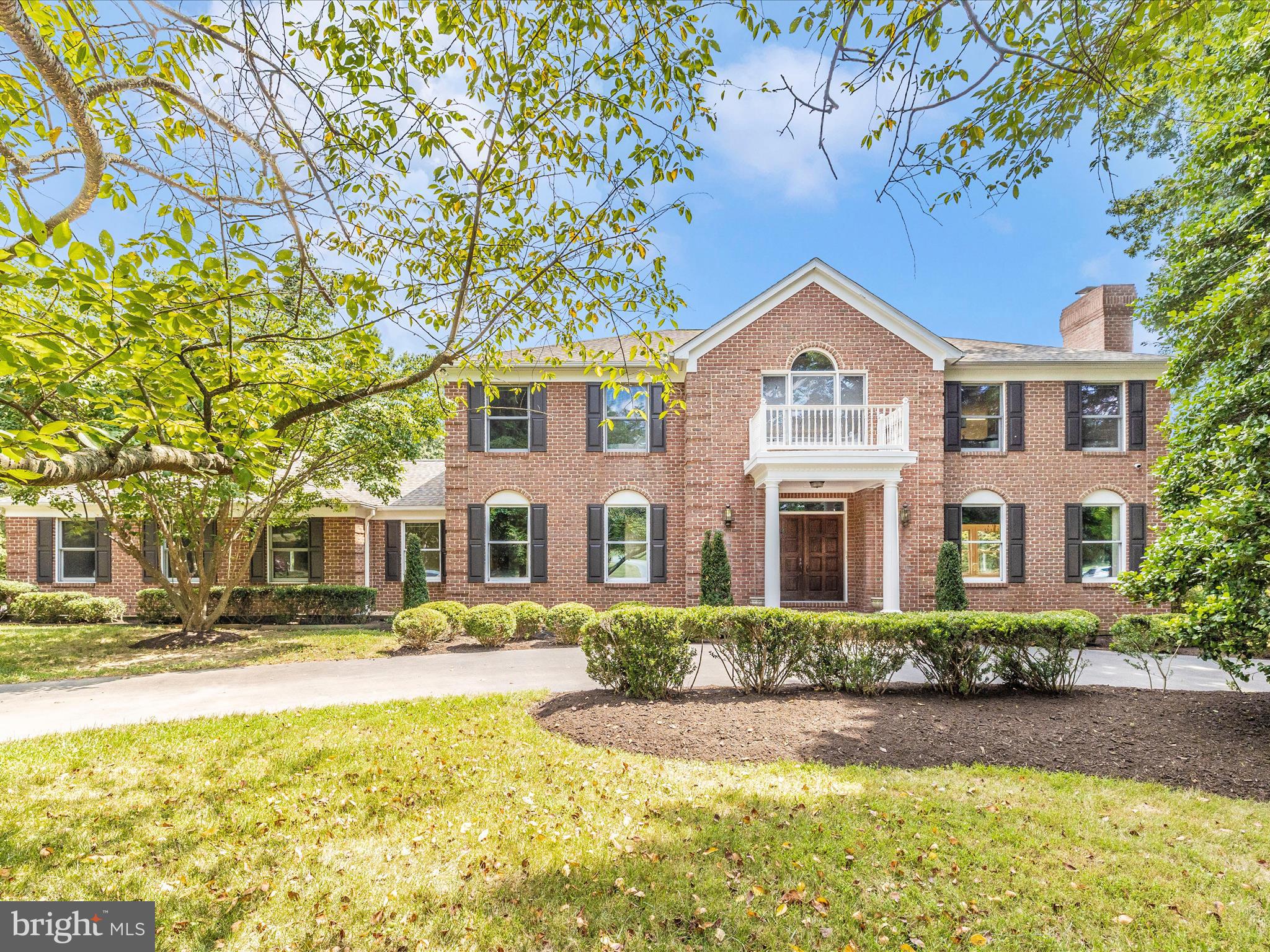 Welcome home to this stunning all-brick residence in the highly sought after neighborhood of White Flint Springs that blends timeless elegance with modern comfort nestled on 1.28 acres in a serene, private setting. As you step inside, you’re greeted by a grand two-story foyer and a sweeping curved hardwood staircase, setting an elegant tone that carries throughout the home. Gleaming hardwood floors span the entire house, and a brand-new roof (installed September 2024) adds lasting peace of mind. Generously sized rooms offer both space and sophistication. The inviting living room features recessed lighting, crown molding, and a cozy wood-burning fireplace, seamlessly flowing into a sunlit dining room perfect for entertaining. From there, step into the open kitchen, complete with subzero refrigerator, stone countertops, a center island with cooktop, and wall oven, ideal for the home chef… The family room provides a warm retreat with a gas-insert fireplace, custom-built-ins, a wet bar, and direct access to a large two-level deck. Step outside to enjoy a beautifully landscaped backyard with a spacious lawn and an in-ground pool... an entertainer’s dream… On the main level, you'll find a private office with custom shelving, a convenient powder room, and a full bathroom for added flexibility… Upstairs, the primary suite is a luxurious escape with dual closets, a skylit bathroom, soaking tub, and separate shower. Three additional bedrooms offer hardwood flooring, with two sharing a Jack-and-Jill bath and one featuring their own private ensuite. The fully finished basement expands your living space with two additional bedrooms, a full bath, and a third wood-burn fireplace... ideal for guests and entertaining… Surrounded by mature trees and nestled among other impressive homes, this property offers a picturesque setting and the comfort of a well-established neighborhood... Do not miss the chance to make this exceptional home your own!