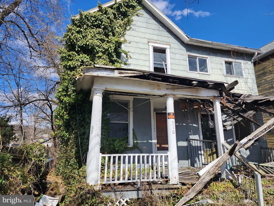 The house at 310-312 Jefferson St has suffered some fire damage and structural damage. Do NOT attempt to enter the house. Property is sold As Is. Jefferson St is a quiet location, and this lot would be nice for a new home. Sale also includes Tax ID# 0104035879.