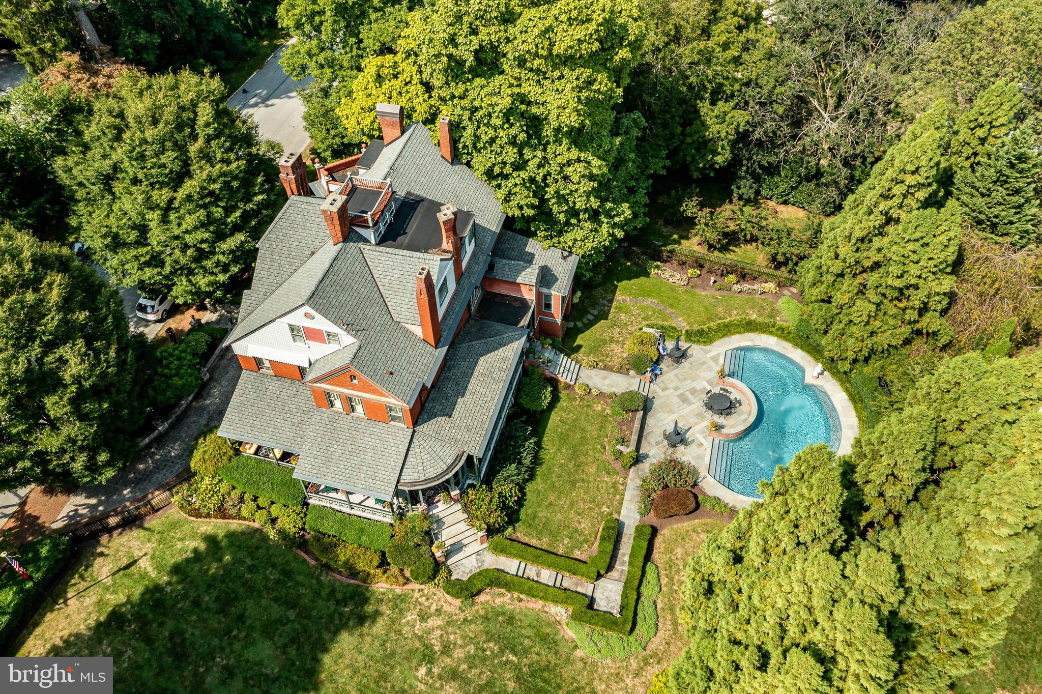 Situated in the finest section of the northern end of the West Chester Borough. Pristine oversized corner lot both sides and rear property fenced with a Gunite in ground pool with fountains and extensive area for entertaining. Overlooking the lush grounds professional landscaping and hardscaping you will be comfortable enjoying the approximate 1,000 square foot covered porch overlooking the pool area & entertaining area. This all-brick Victorian single is one of the most exceptional residence located in the Borough. On the interior you are greeted by museum quality appointments, 11-foot ceilings, spectacular original stained woodwork with pocket doors, panel ceilings and side walls, 10 fireplaces 7 of which have natural gas inserts and 3 wood burning. Architectural antique lighting, bradbury and bradbury wallpaper and Tiffany-stained glass. Current owner purchased in 1996 and has added addition to the kitchen which is currently being used as a family room and adjoining butler pantry. Many other upgrades have been done by current owner please see Seller Disclosure. Main floor you enter through an oversized dutch door into a spectacular foyer flanked by formal living room and library/den, spacious living room, kitchen, family room and butlers pantry. The second floor offers 4 bedrooms, 3 full baths which includes the grand master suite with fireplace and lavish master bath. Upper level offers 3 additional bedrooms and an additional full bath. Stairs lead you to the widows walk which is a great place to enjoy evening cocktails and see those magnificent vistas. The lower-level walkout is partially finished which can be used as an in-law suite or an overnight stay for guests, has a kitchen and full bath with direct non-steps to the outside. Natural gas heat and central air conditioning. This is a one of kind. Electric monthly & yearly amounts include gas.